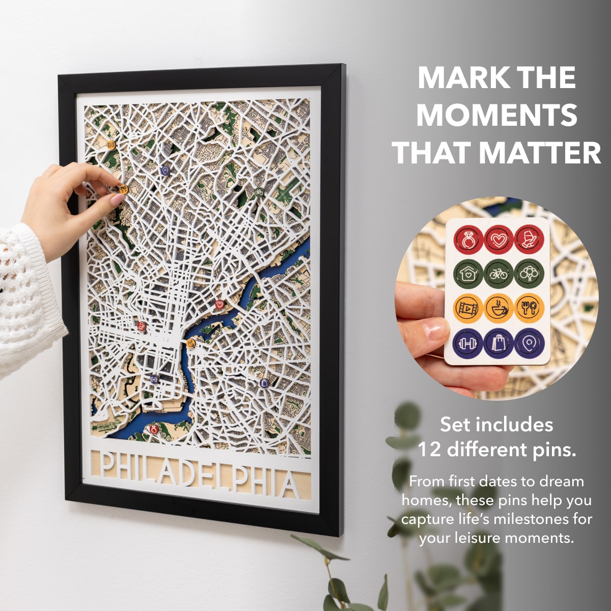 Framed map of Philadelphia with decorative pins on a white background