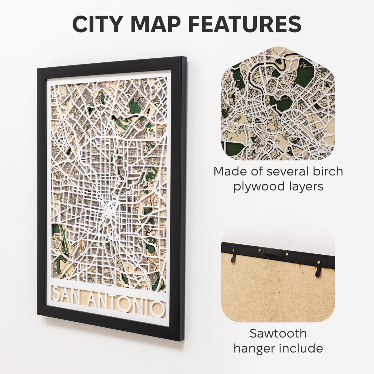 Framed map of San Antonio with decorative pins on a white surface.