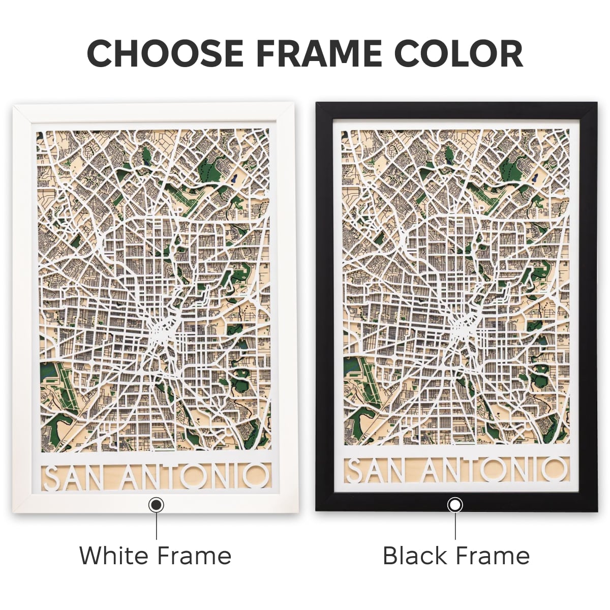 Framed map of San Antonio with decorative pins on a white surface.