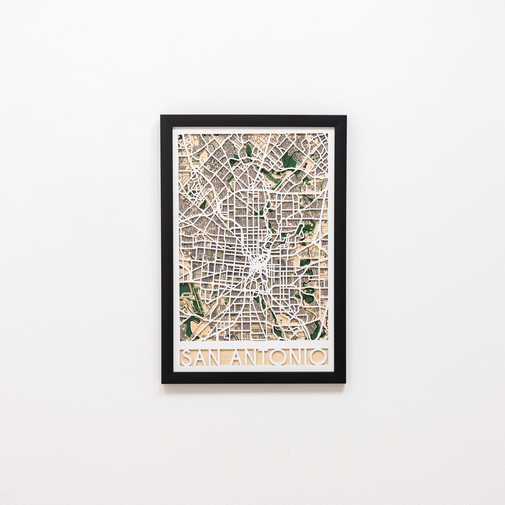 Framed map of San Antonio on a white wall
