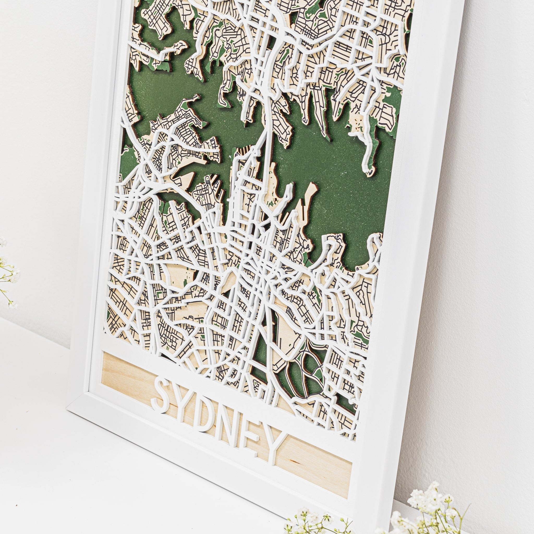 Framed 3D paper city map of Sydney on a white background