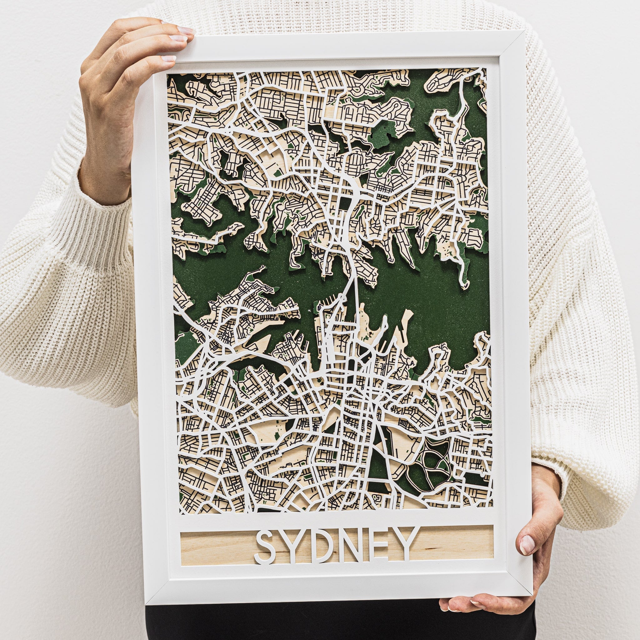Framed 3D map of Sydney held by a person