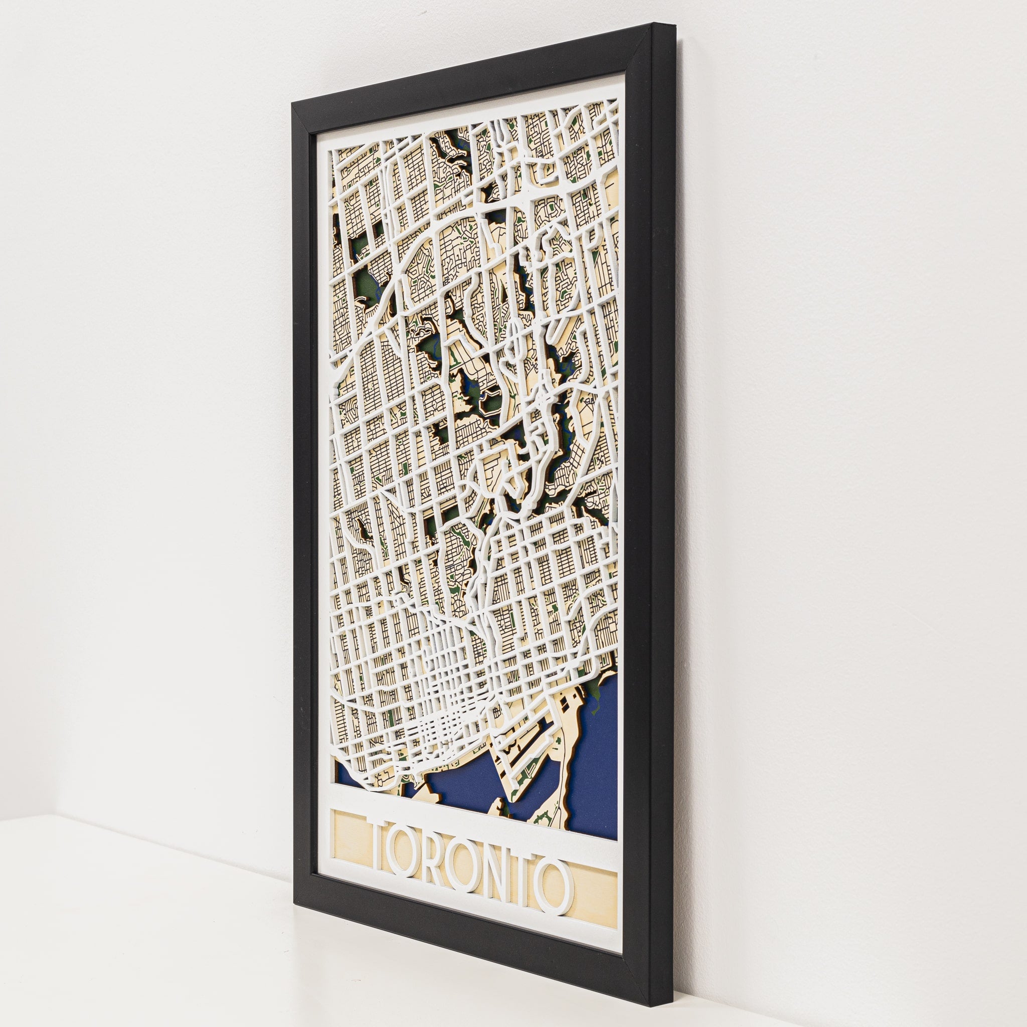 Framed map of Toronto on a white wall