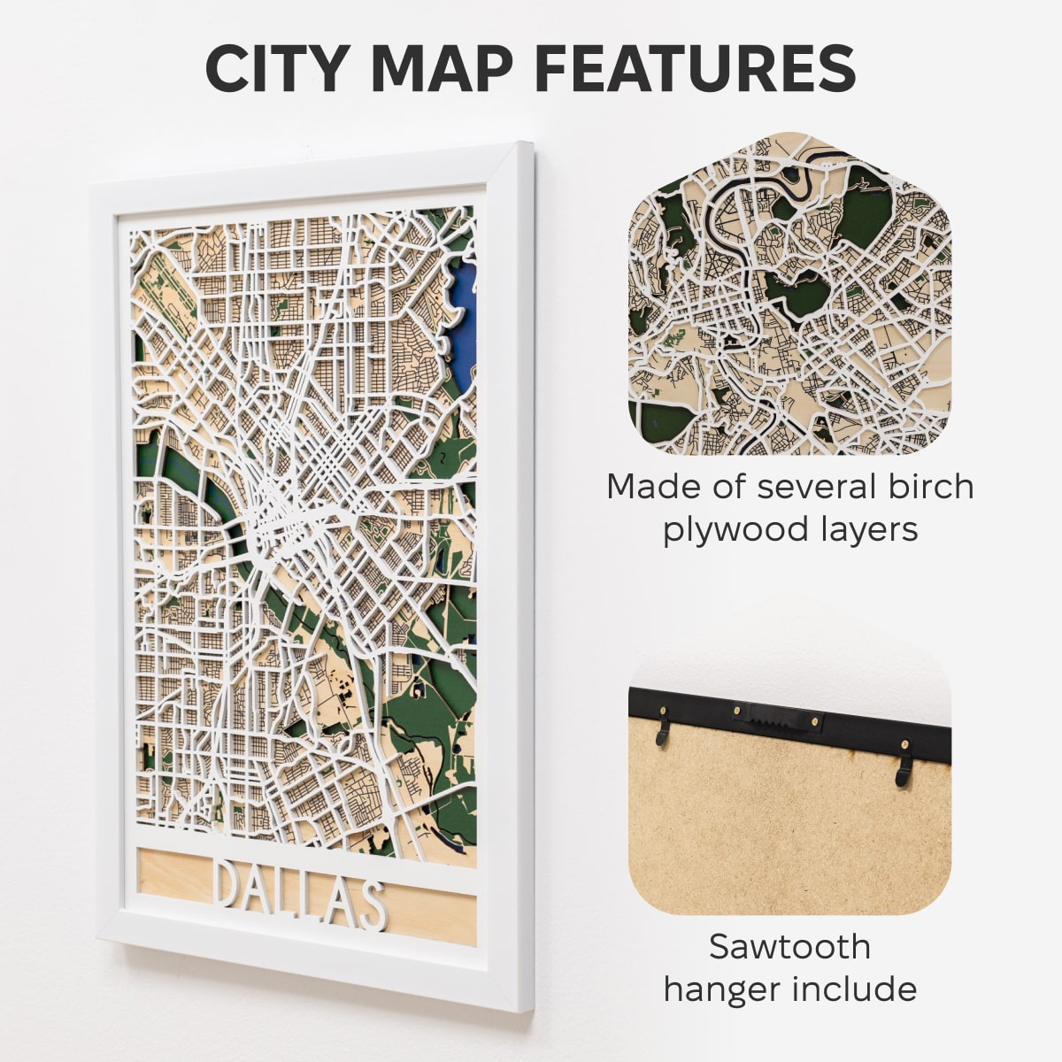 Woman hanging a framed map on a wall next to a wooden side table with books and a plant.