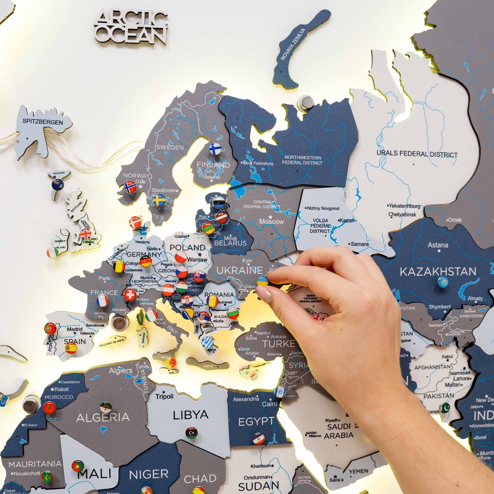 Map of Europe with flags and a hand interacting with it