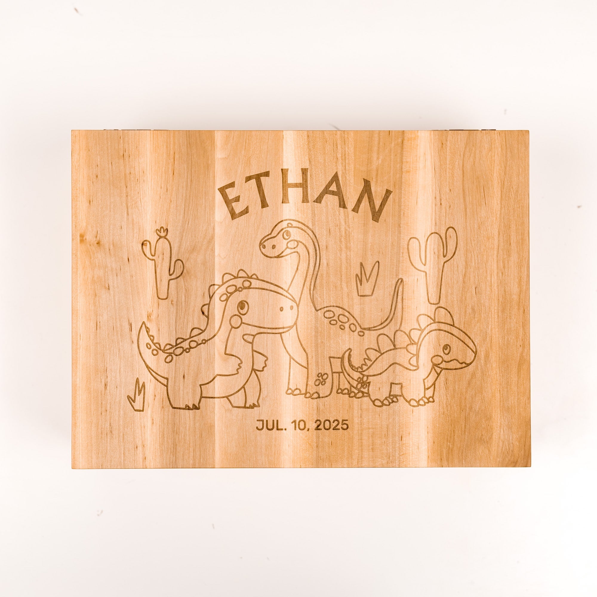 Wooden plaque with engraved dinosaurs and text on a white background