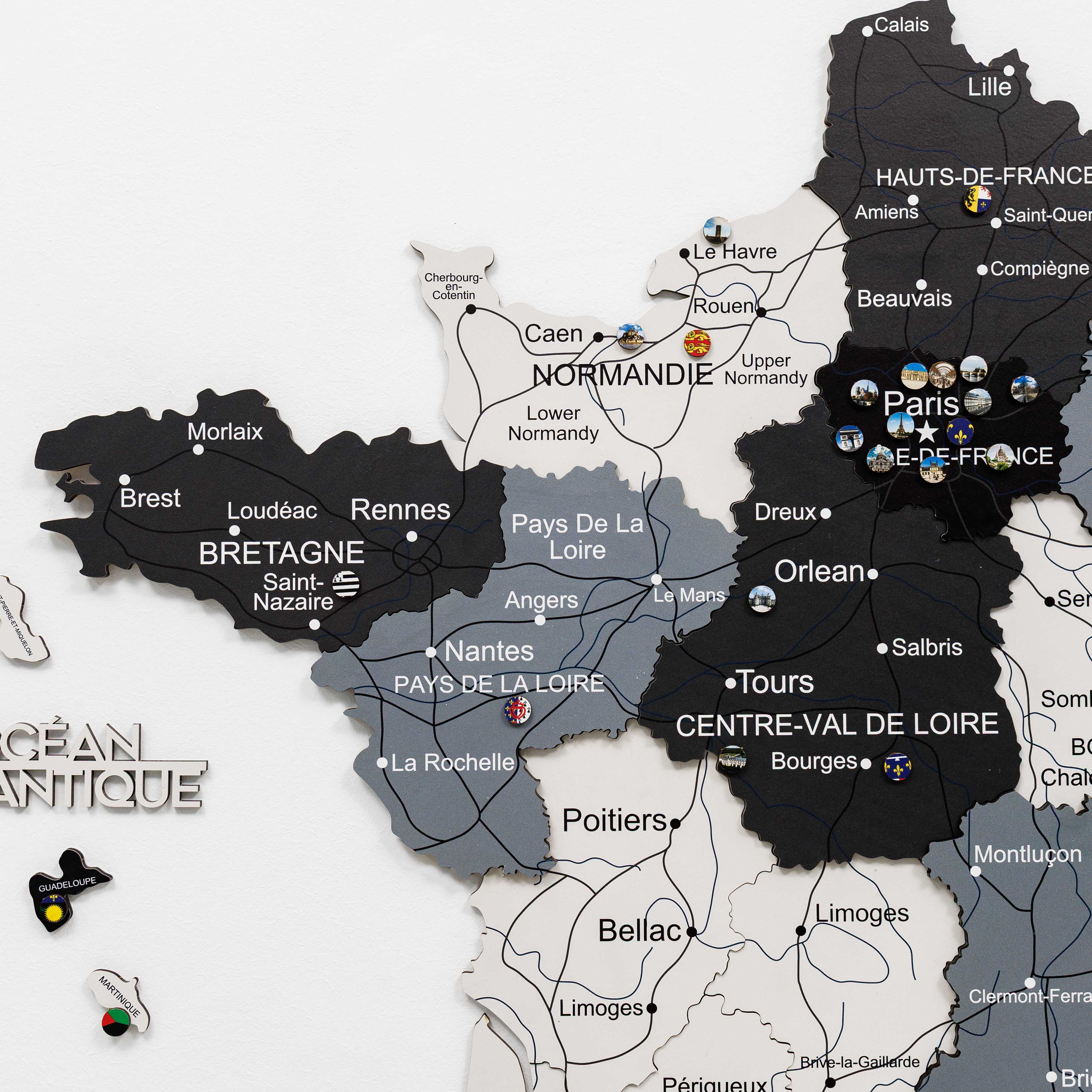 Woman interacting with a wall-mounted map of France