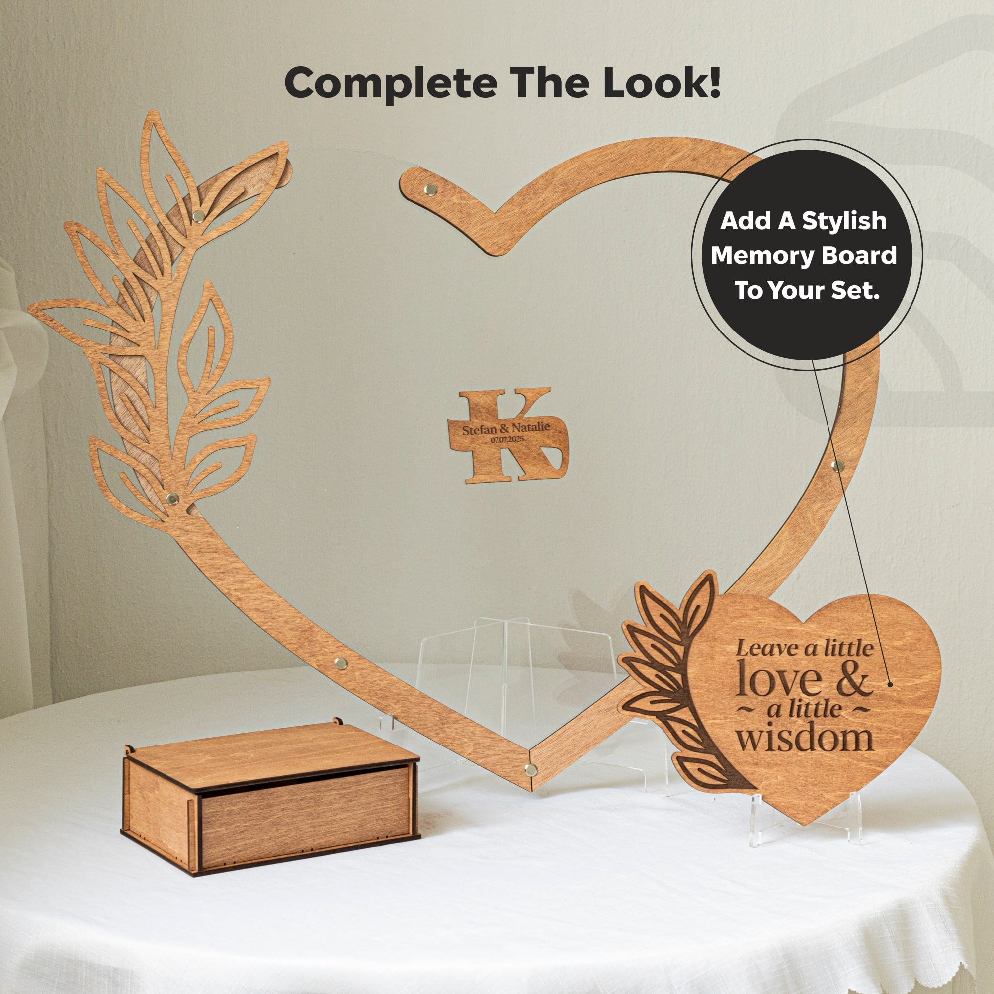 Wooden heart-shaped memory board with decorative elements on a white surface.