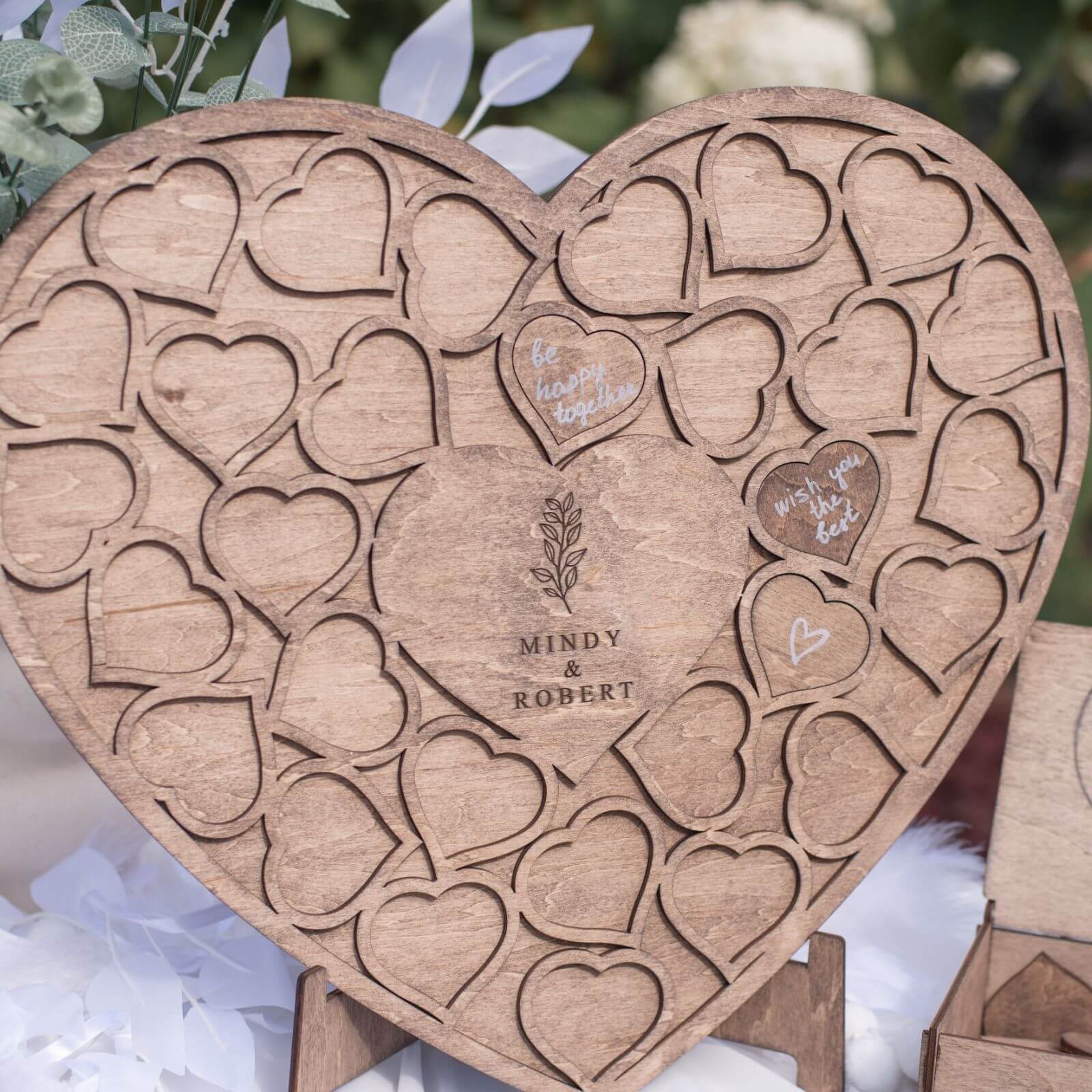 Wooden heart wedding guest book with engraved names
