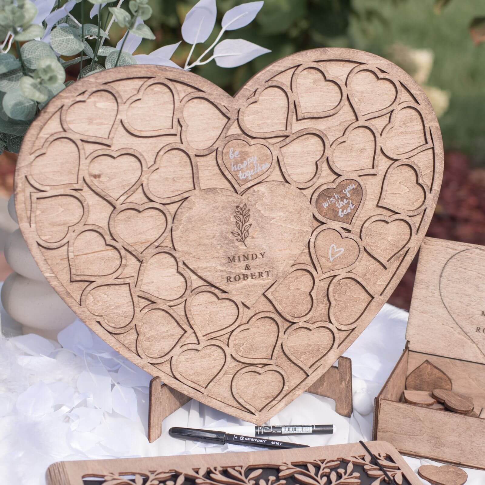 Rustic heart shaped wedding guest book with wooden hearts