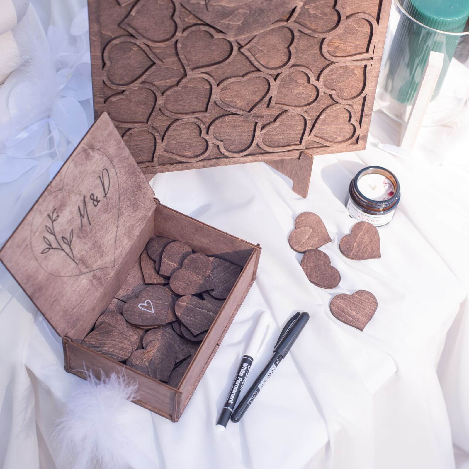Wooden box with dark heart inserts and markers for wedding guest book
