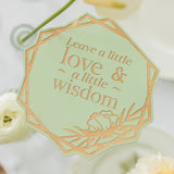 Decorative tag with 'Leave a little love & a little wisdom' text on a light green background.