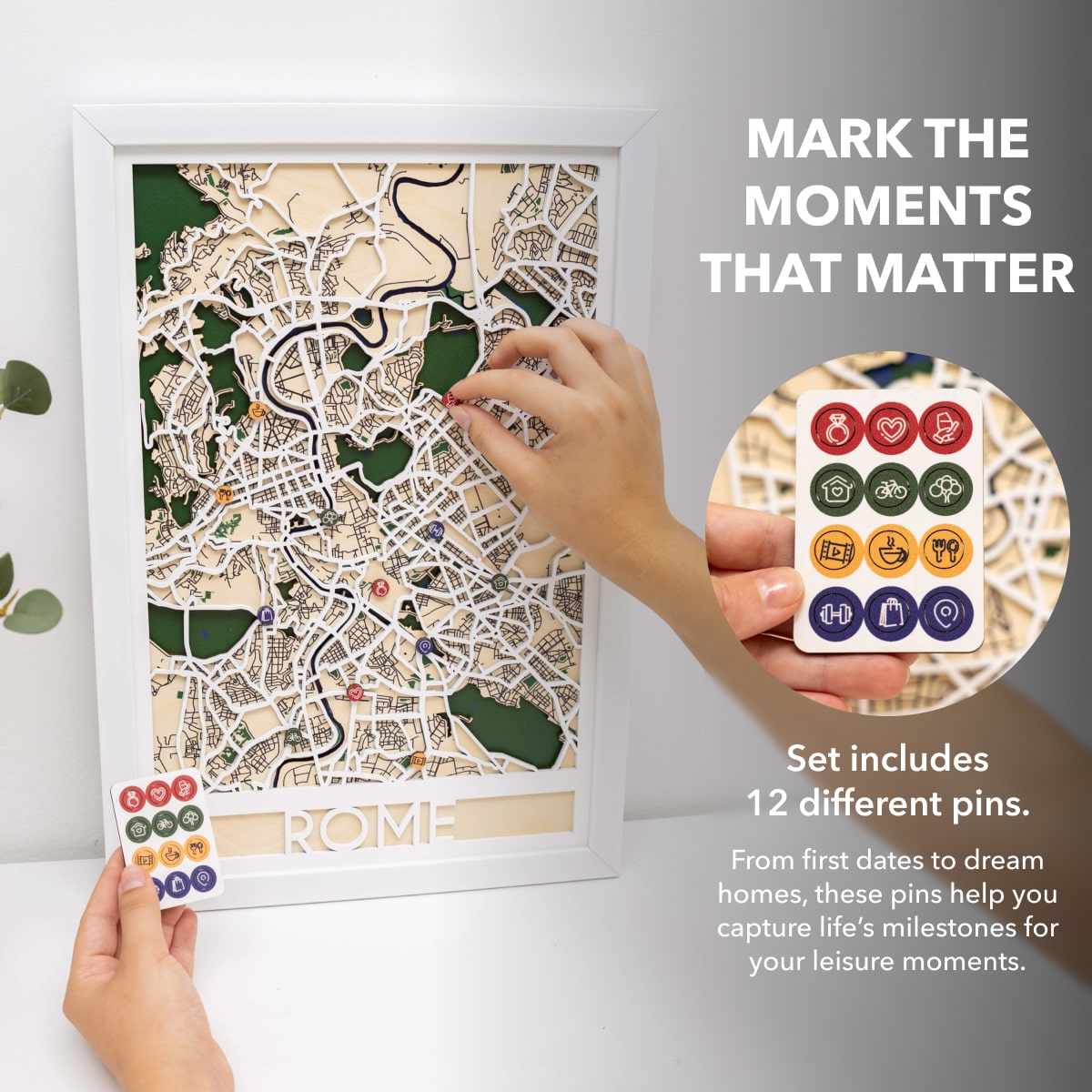 Map of Rome with decorative pins and a hand holding additional pins on a white background.