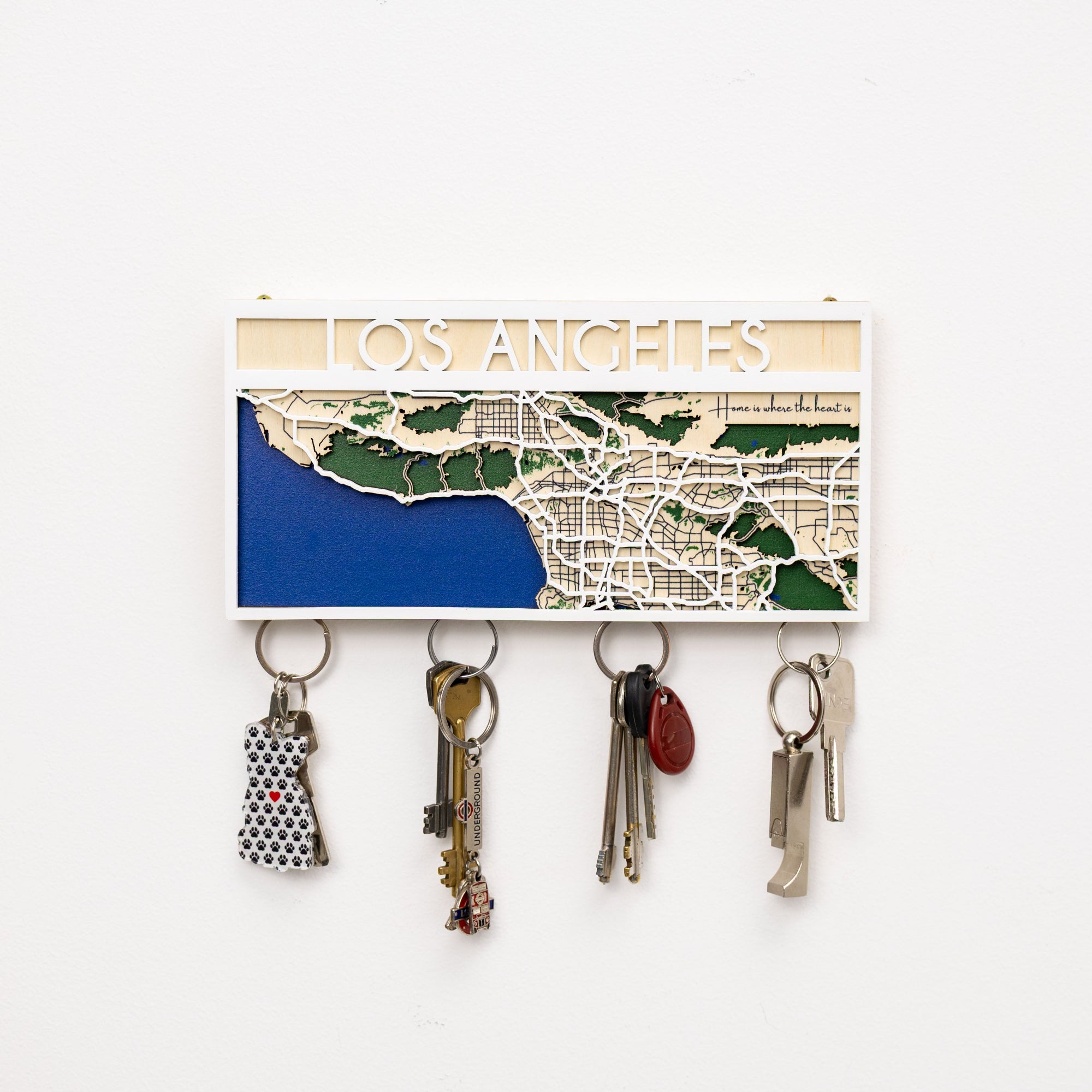 Key holder with a map of Los Angeles and keys attached on a white background