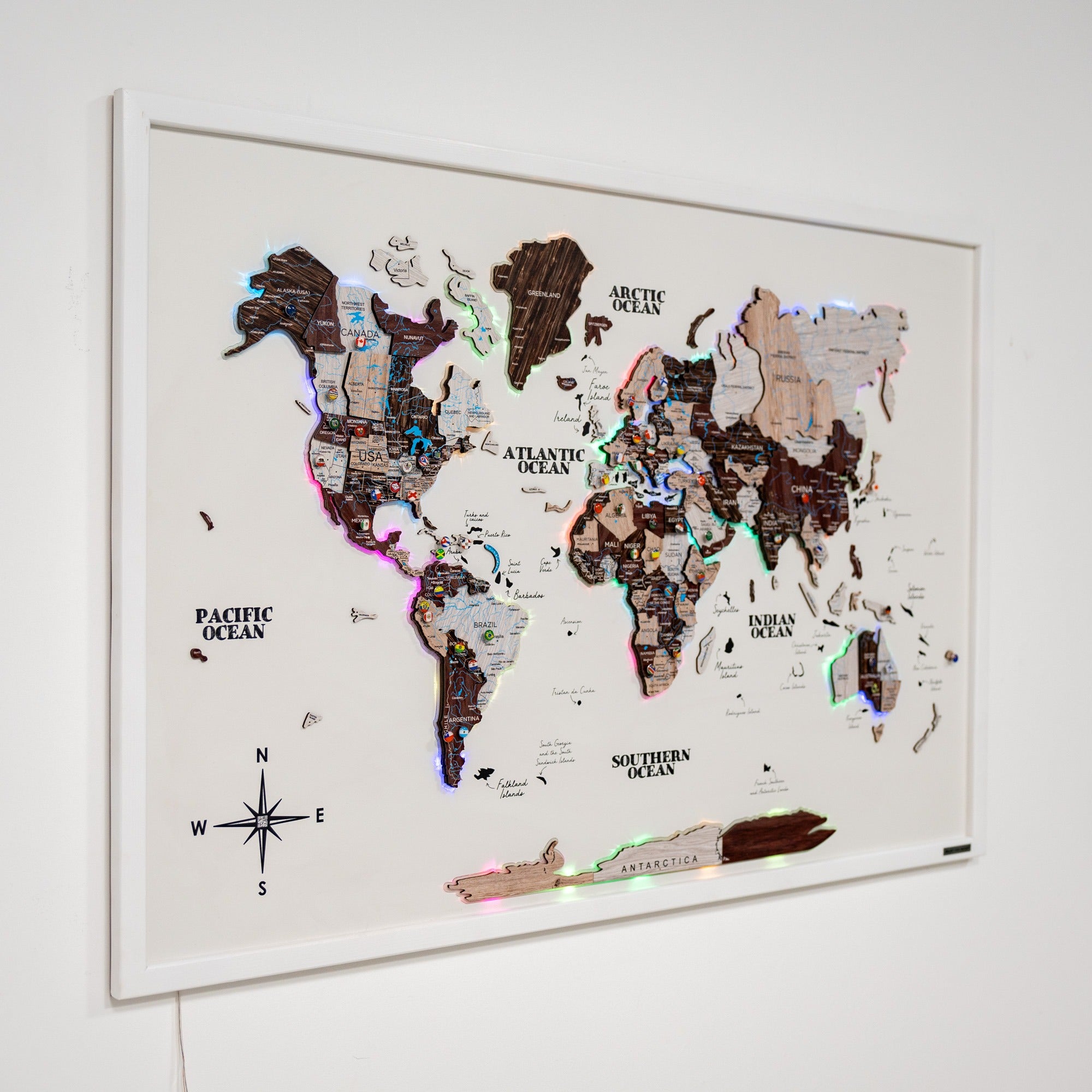 World map with LED lights on a white wall