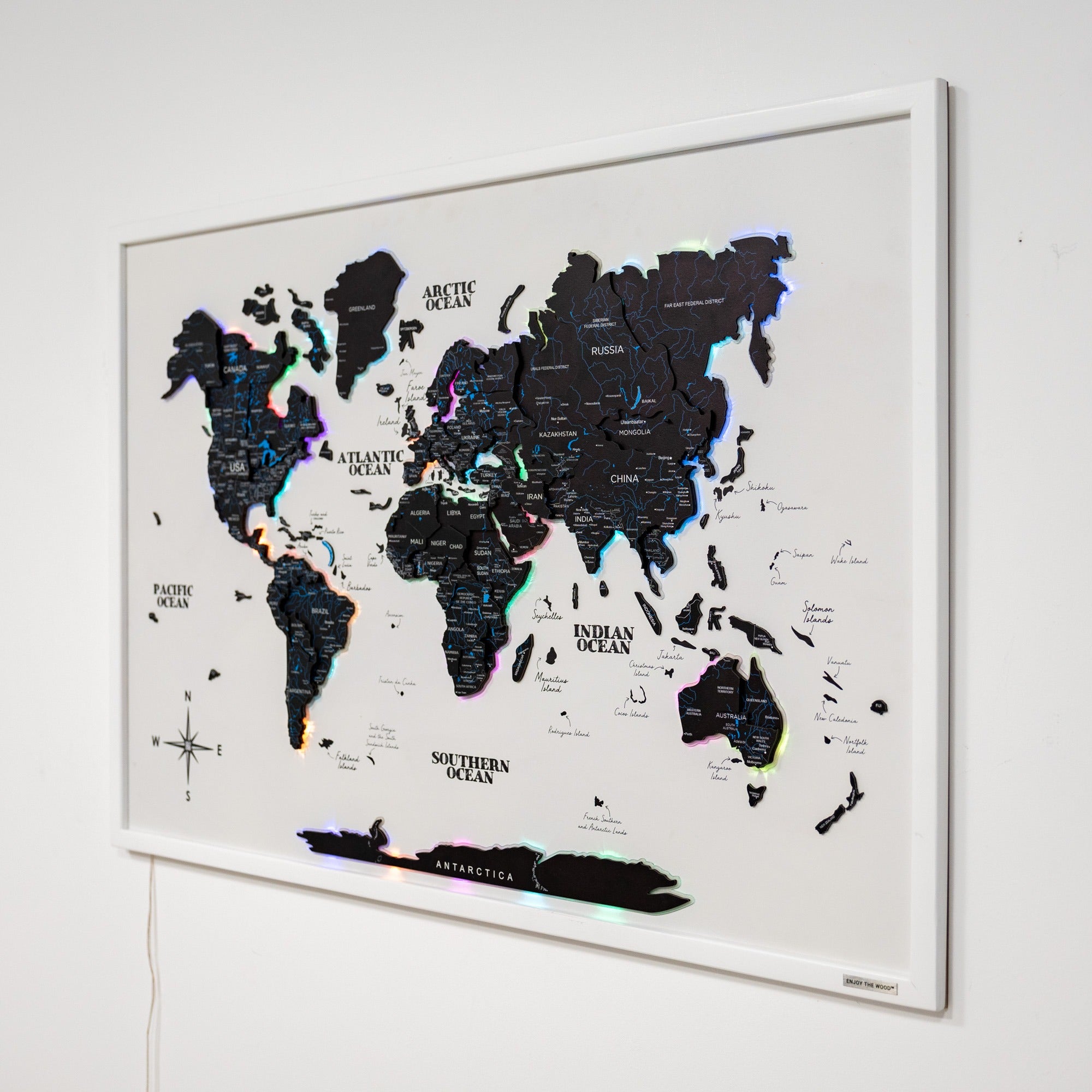 World map with LED lights on a white wall