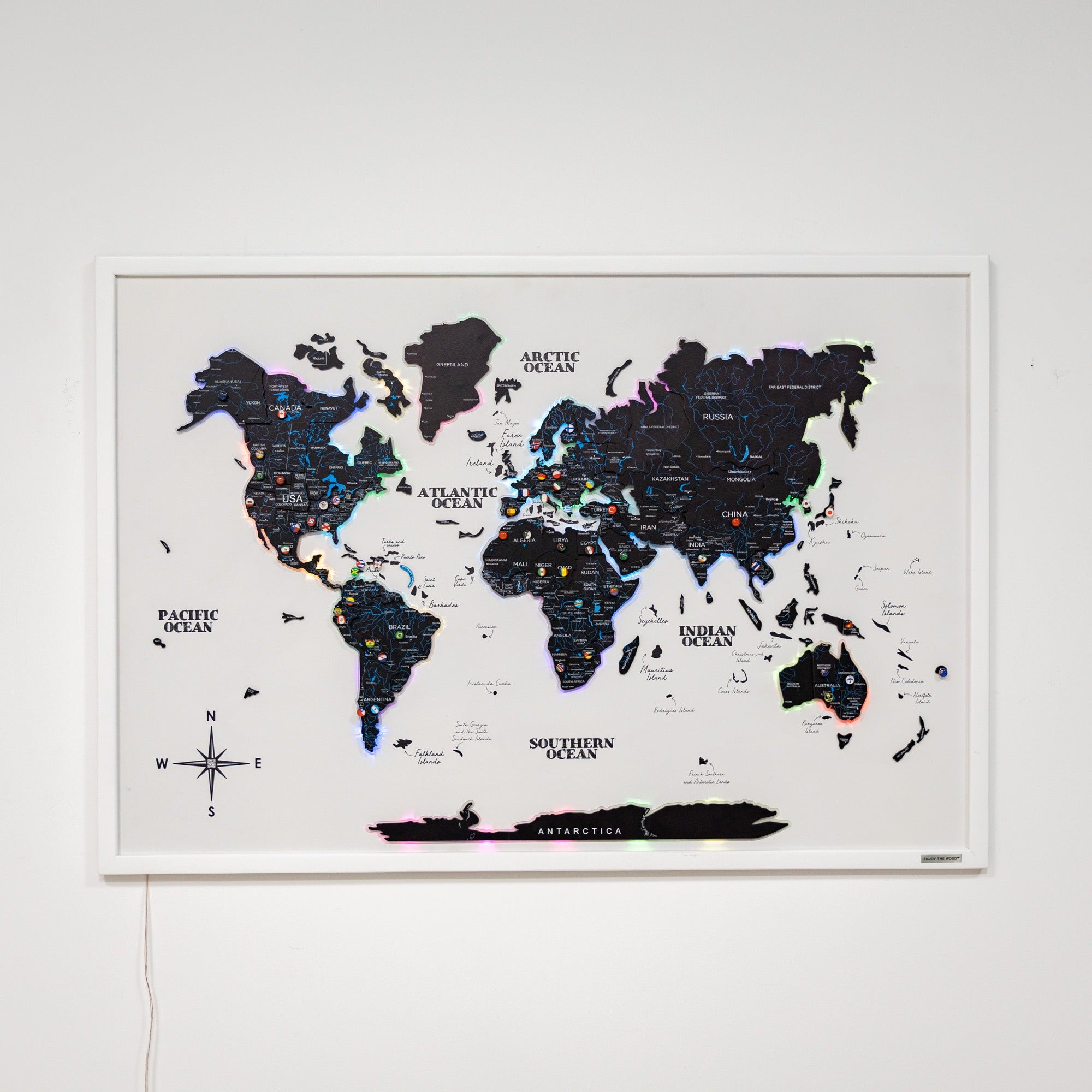 World map poster on a white wall