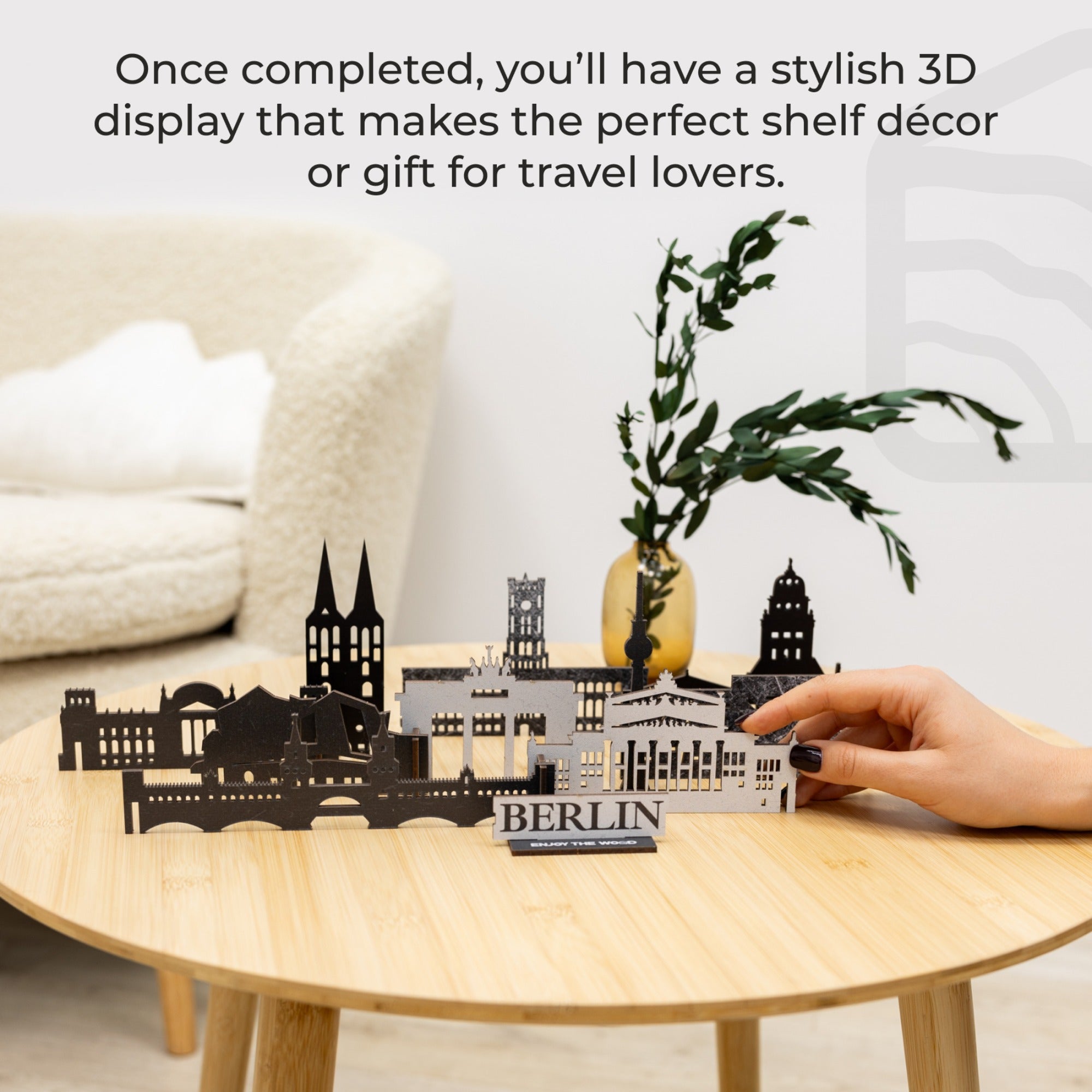 3D cityscape model on a table with text about its use as decor or gift for travel lovers.