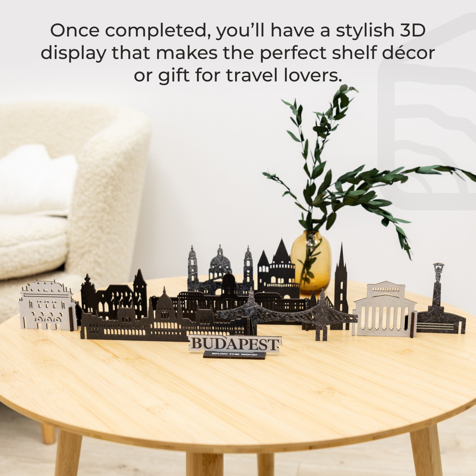 3D cityscape display on a table with text about travel decor.