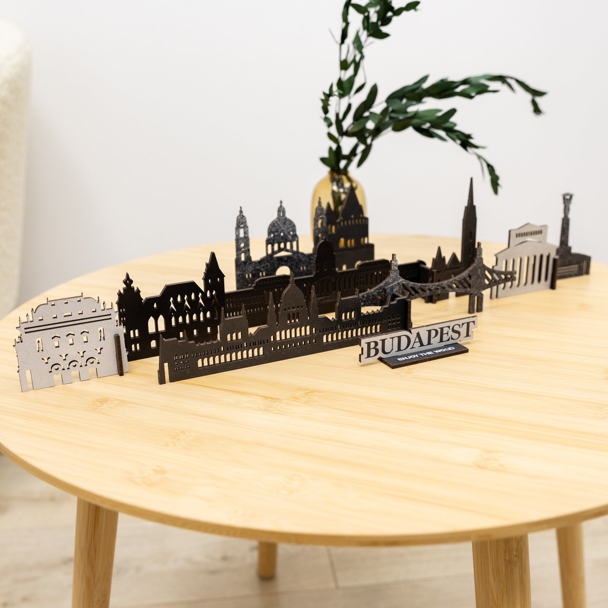 Model of Budapest skyline on a wooden table with a plant in the background