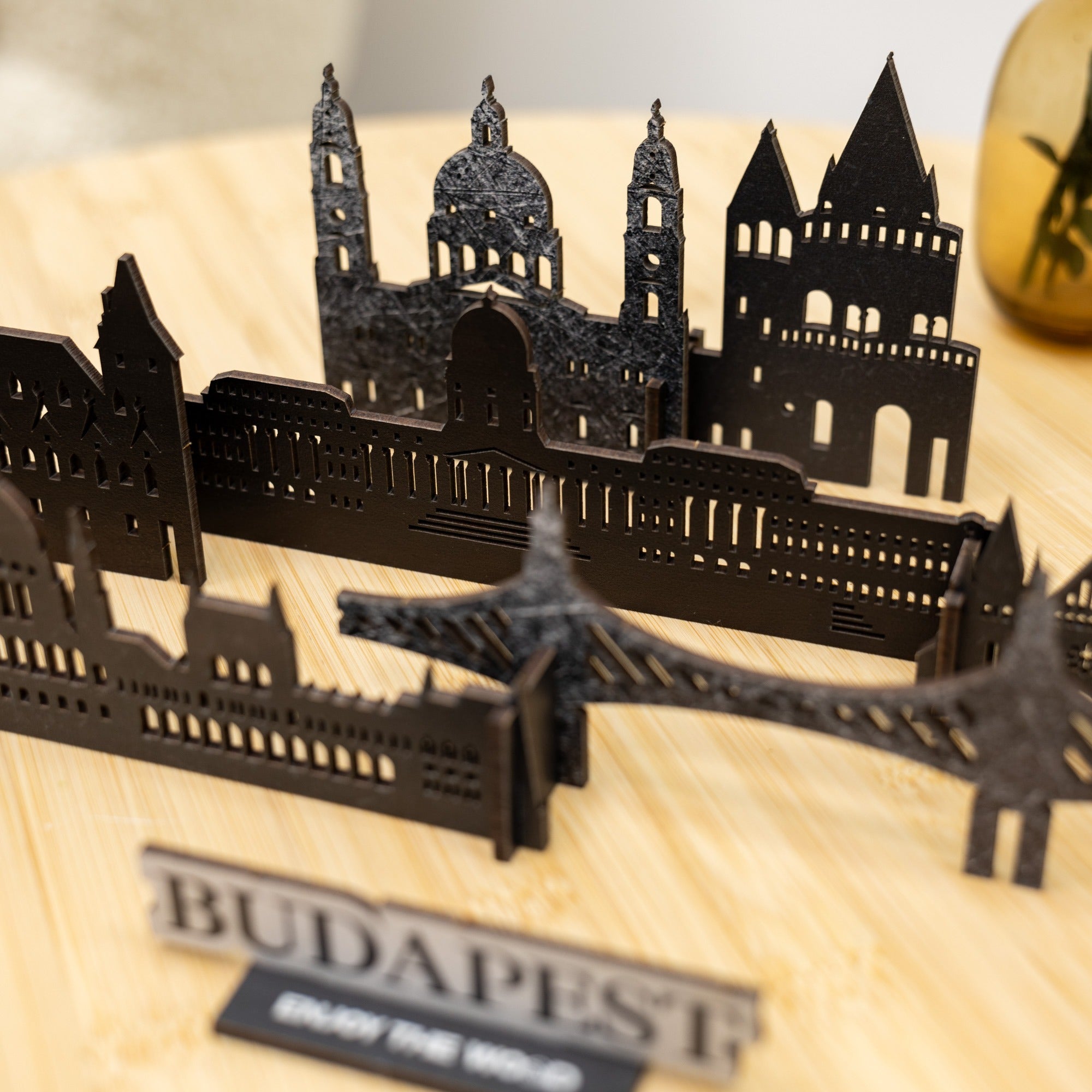 Black cut-out cityscape of Budapest on a wooden base with 'Budapest' label.