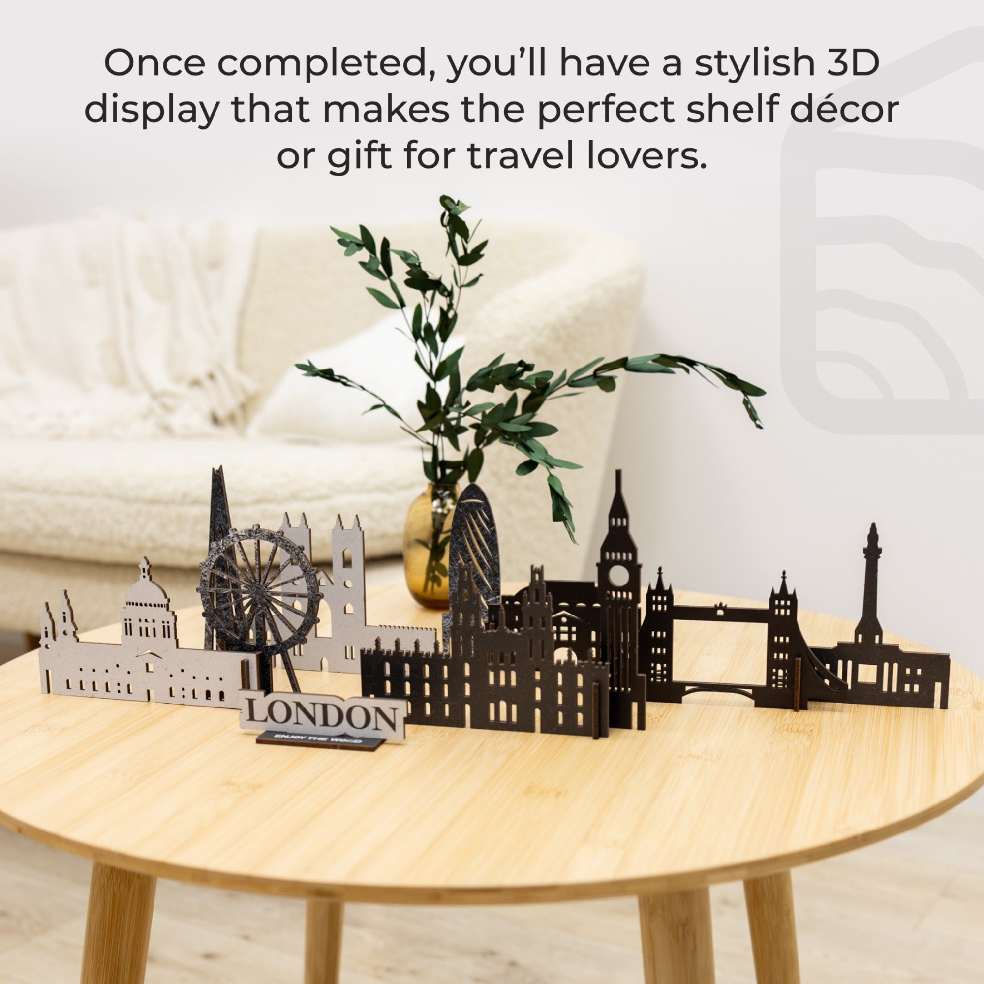 3D cityscape model on a wooden table with text about its use as decor or gift.