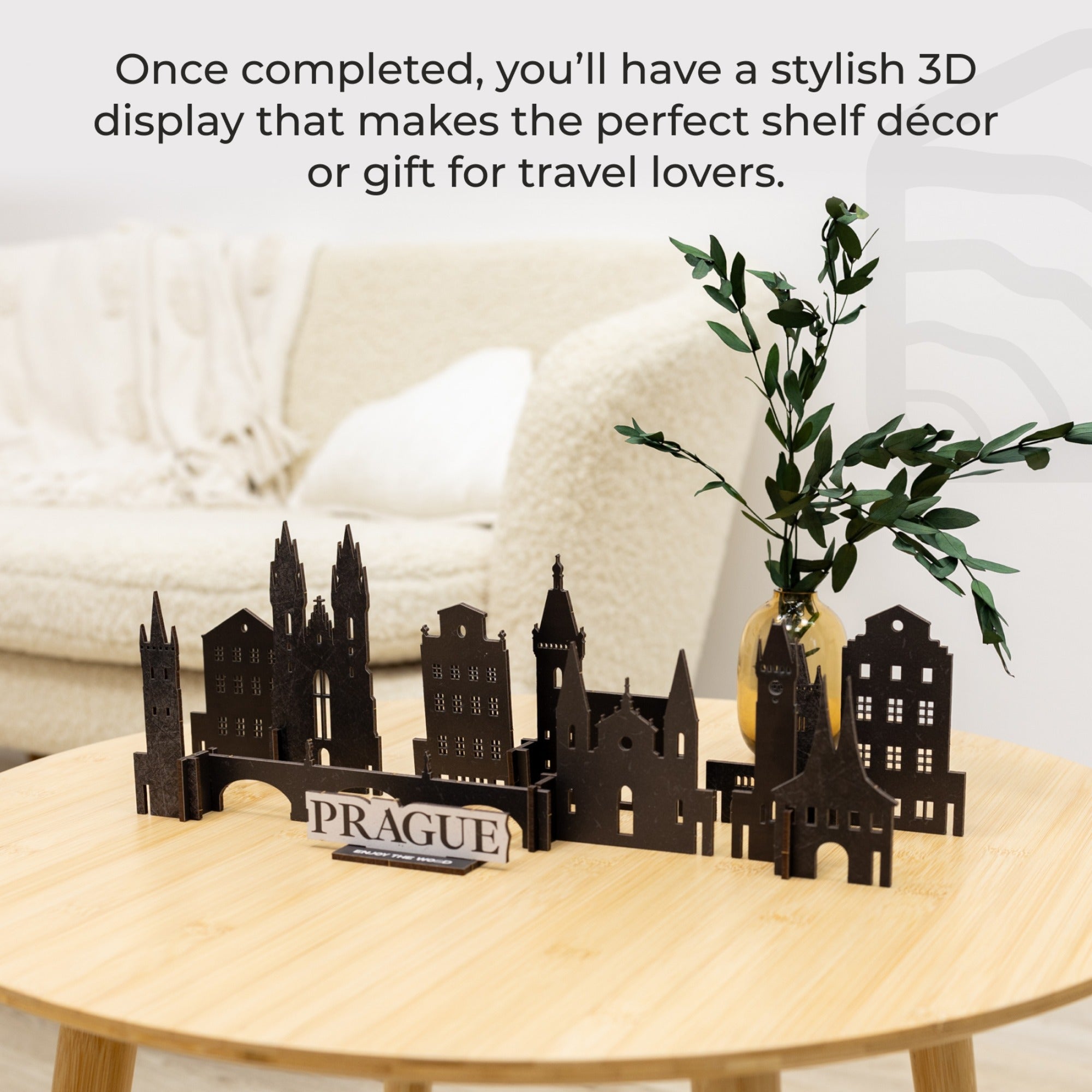 3D Prague cityscape model on a wooden table with text about shelf decor and travel gifts.