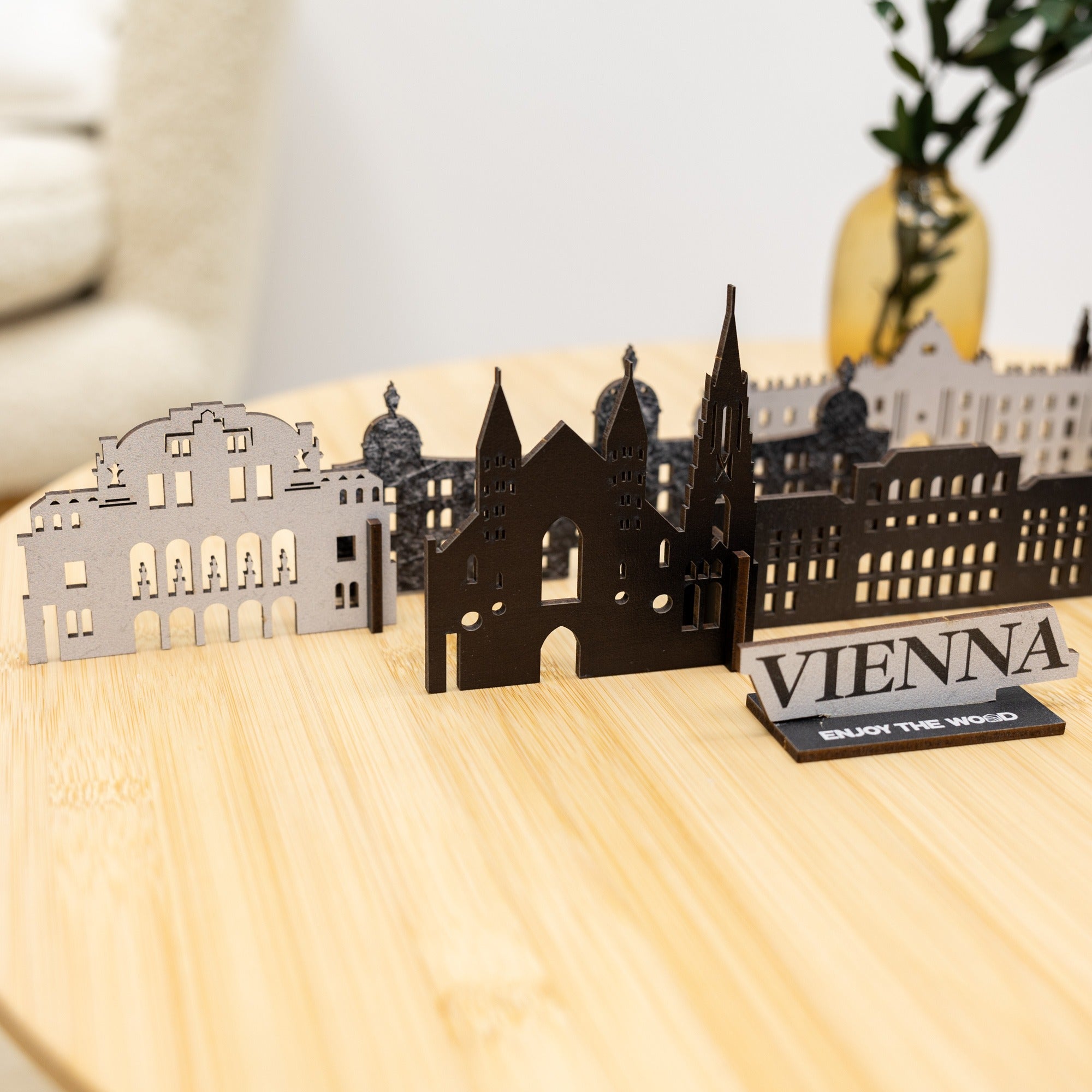 Model of Vienna with cut-out buildings on a wooden surface