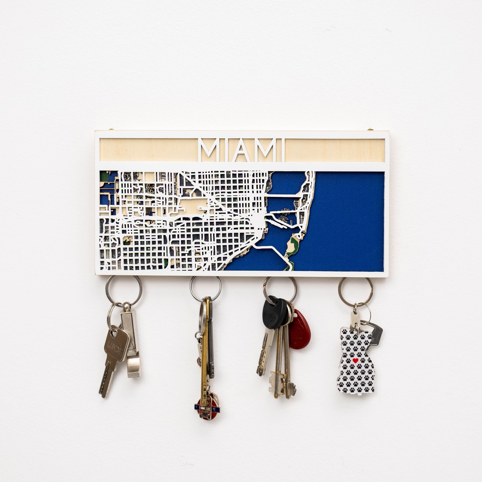Key holder with a map of Miami and keys attached on a white background