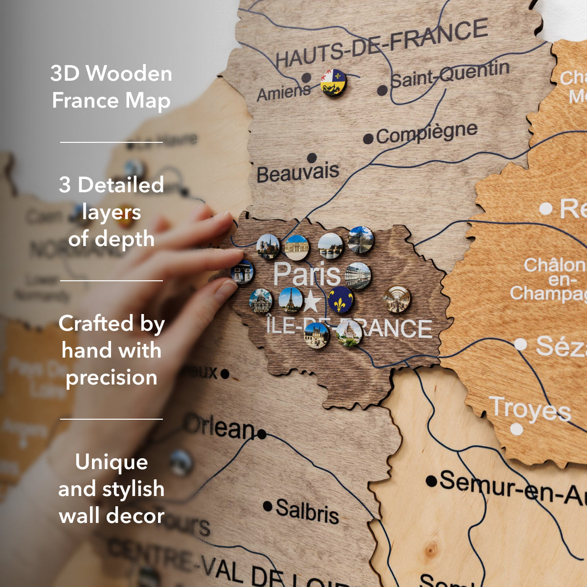 Wooden map of France with pins and text highlighting features