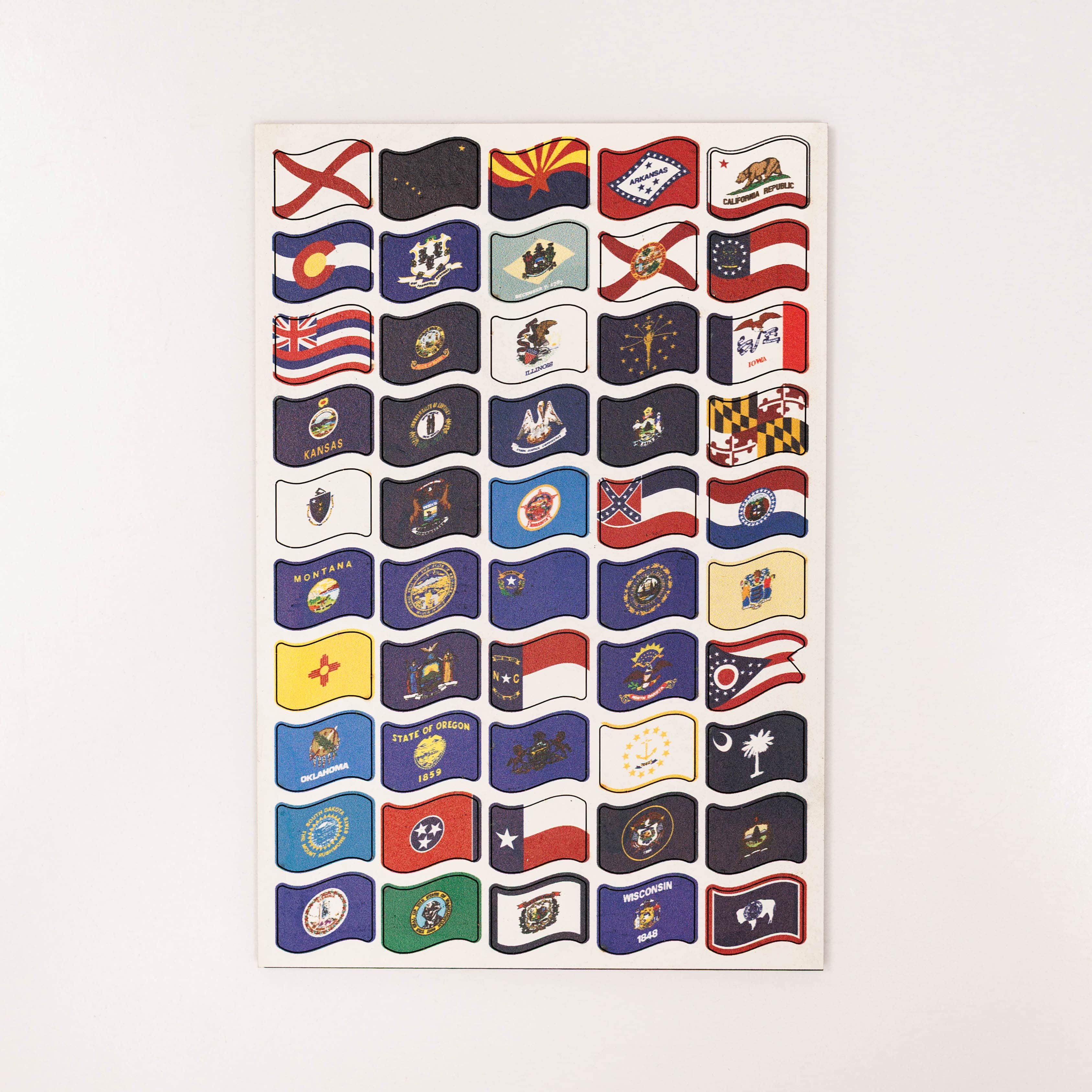 Sheet of U.S. state flags on a white background