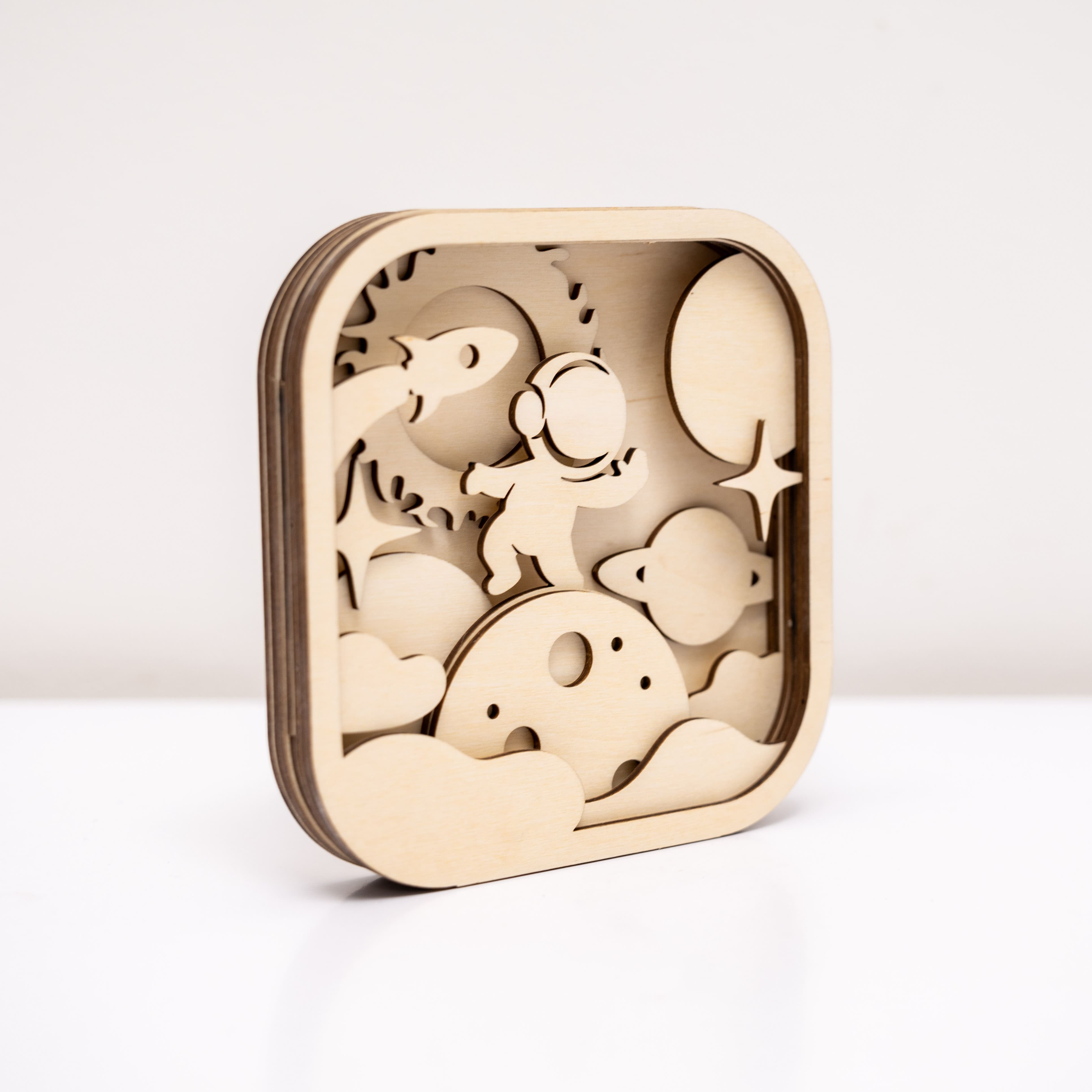 Wooden puzzle with cut-out shapes on a white background