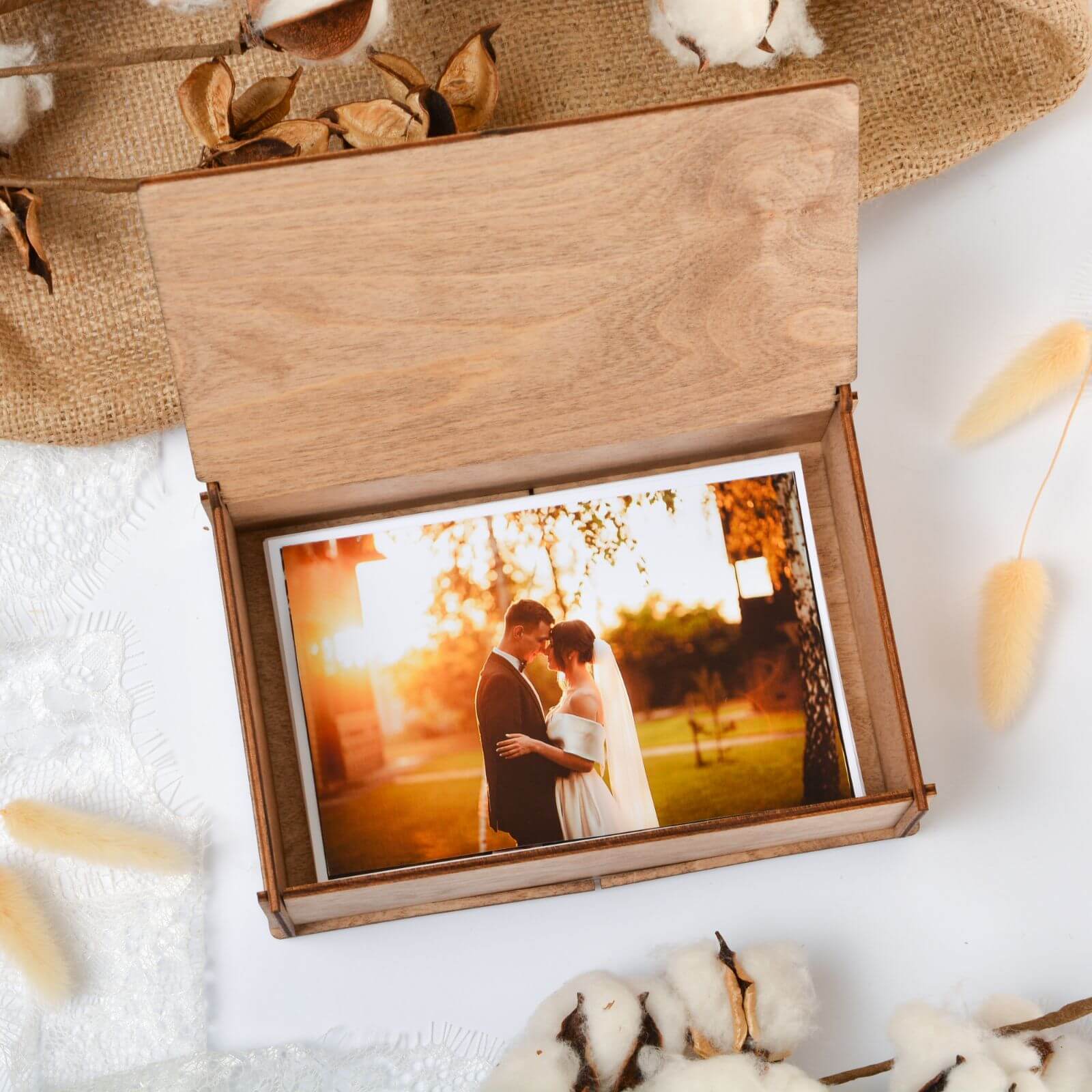 Open wooden box holding wedding photo memory keepsake gift