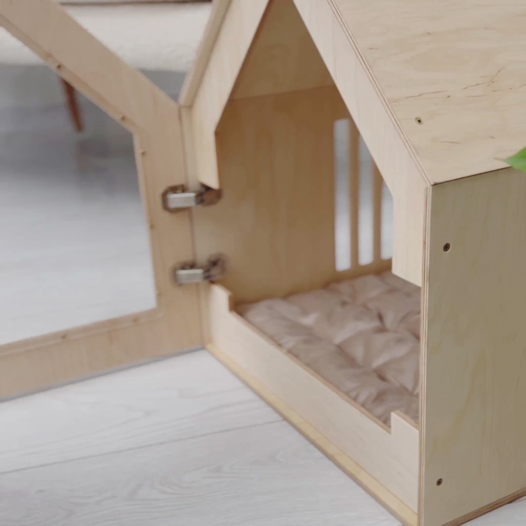 Wooden pet house with modern design and openable door, small dog stepping out.