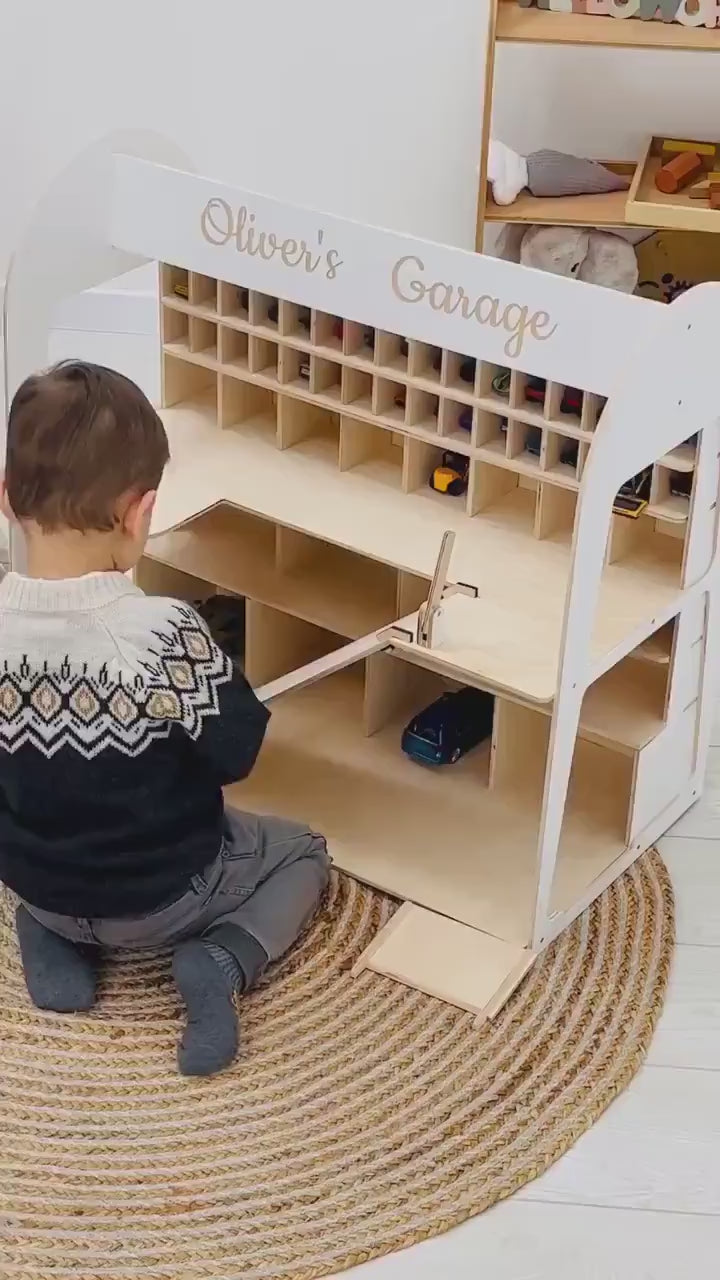 Kid playing with cars on wooden garage organizer