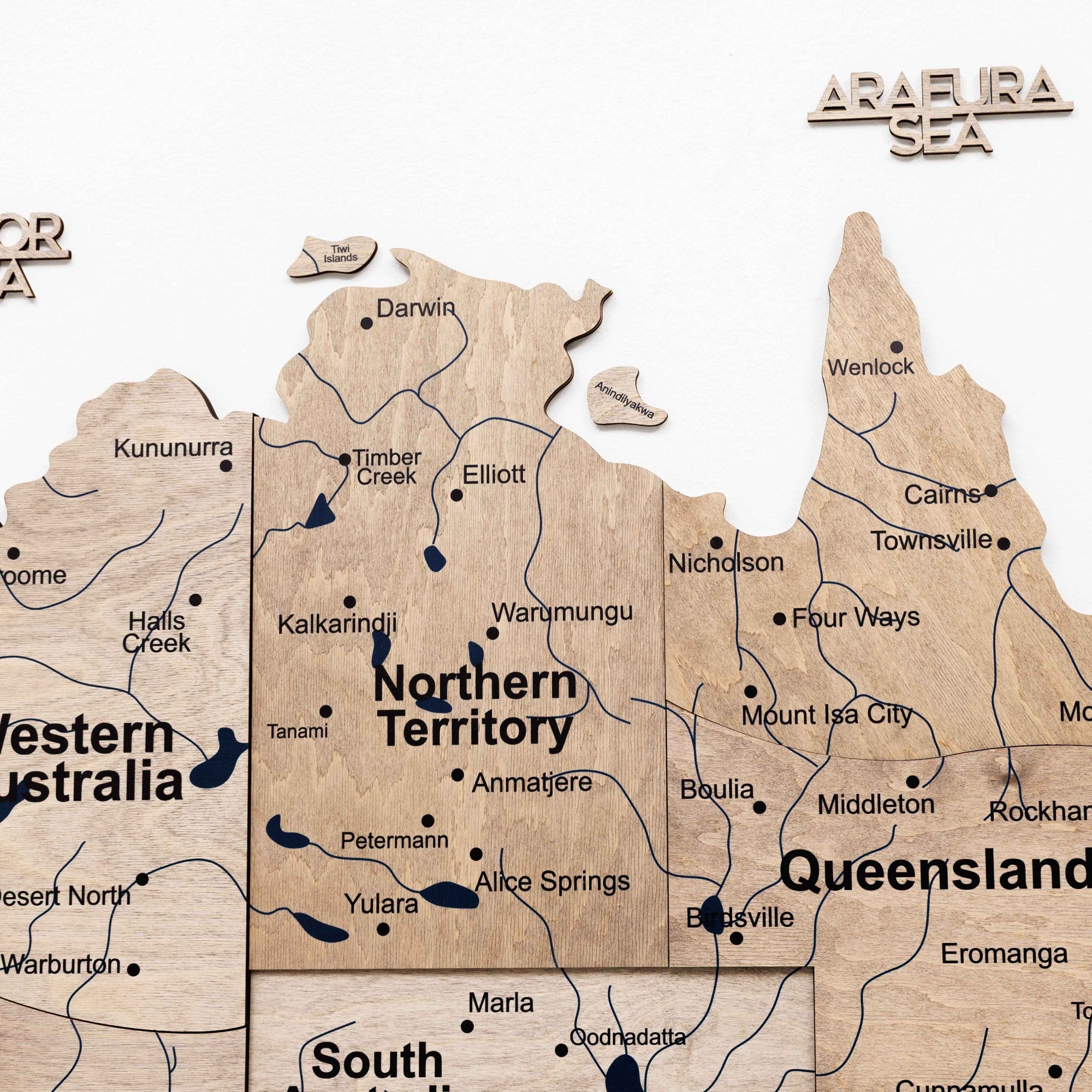 Map of Australia with wooden texture, showing states and regions.