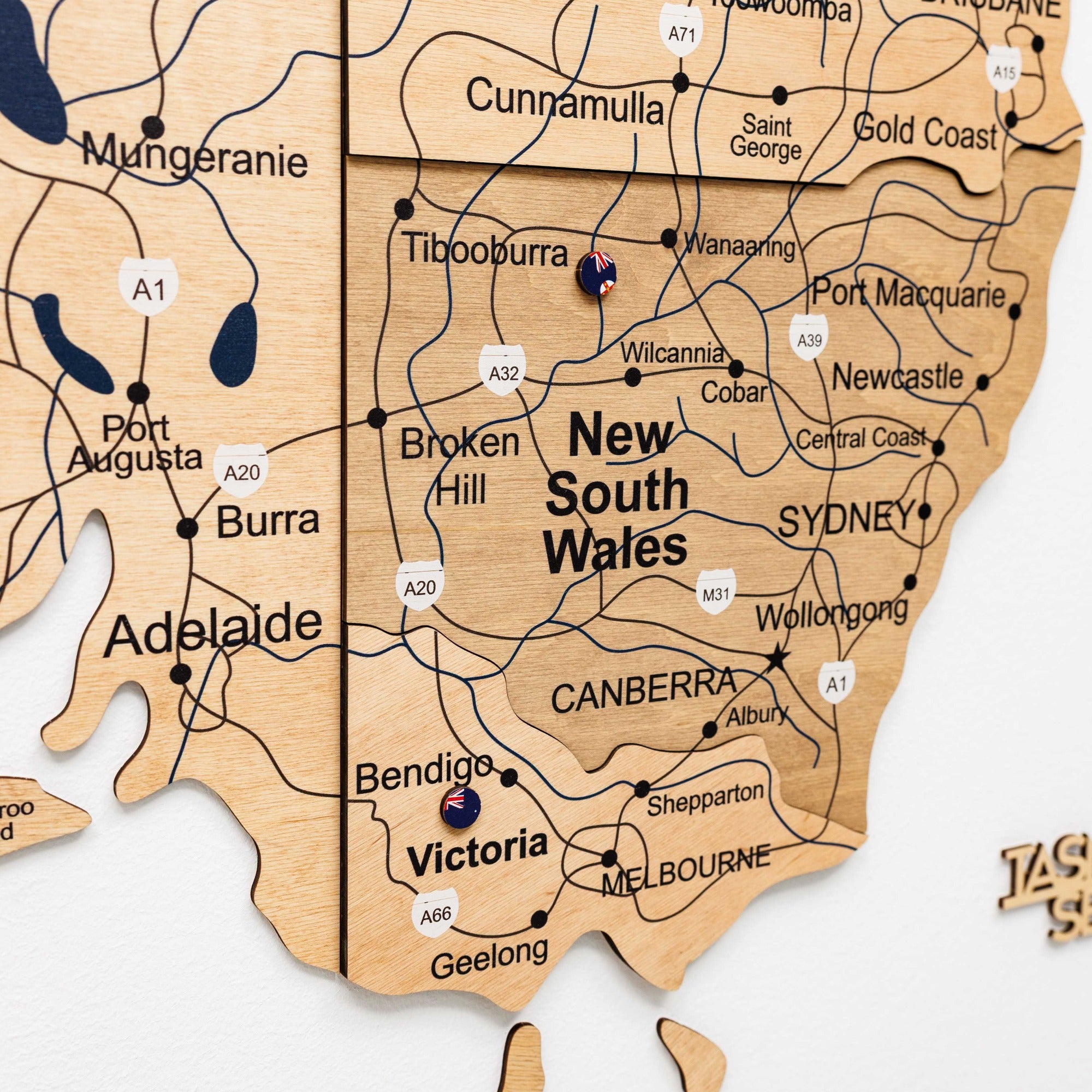 Wooden map of New South Wales, Australia with cities labeled
