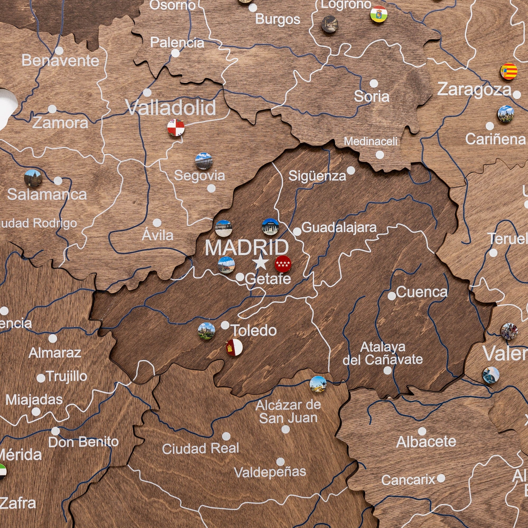 Map of Spain with Madrid highlighted on a wooden texture background