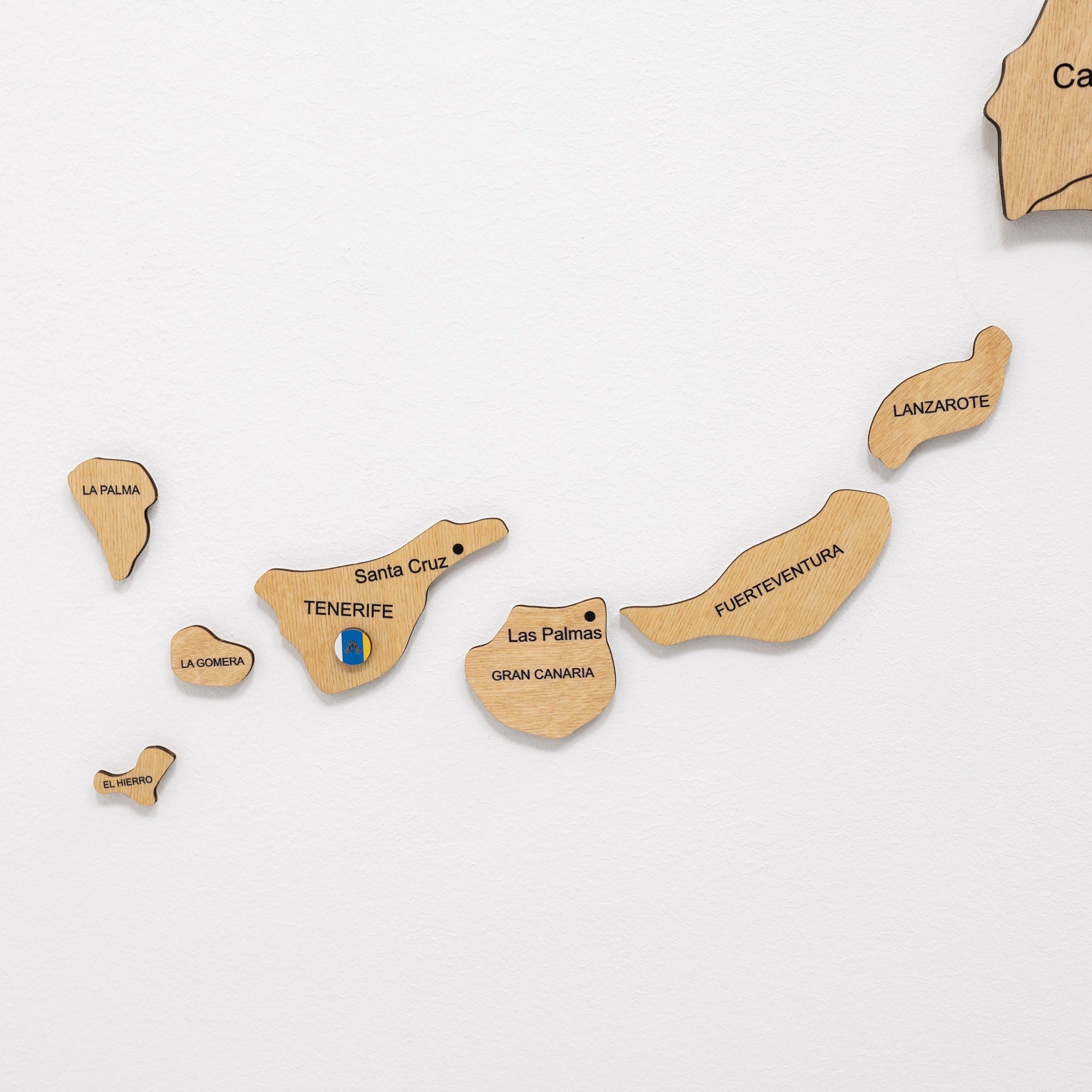 Wooden map of the Canary Islands with each island labeled on a white background