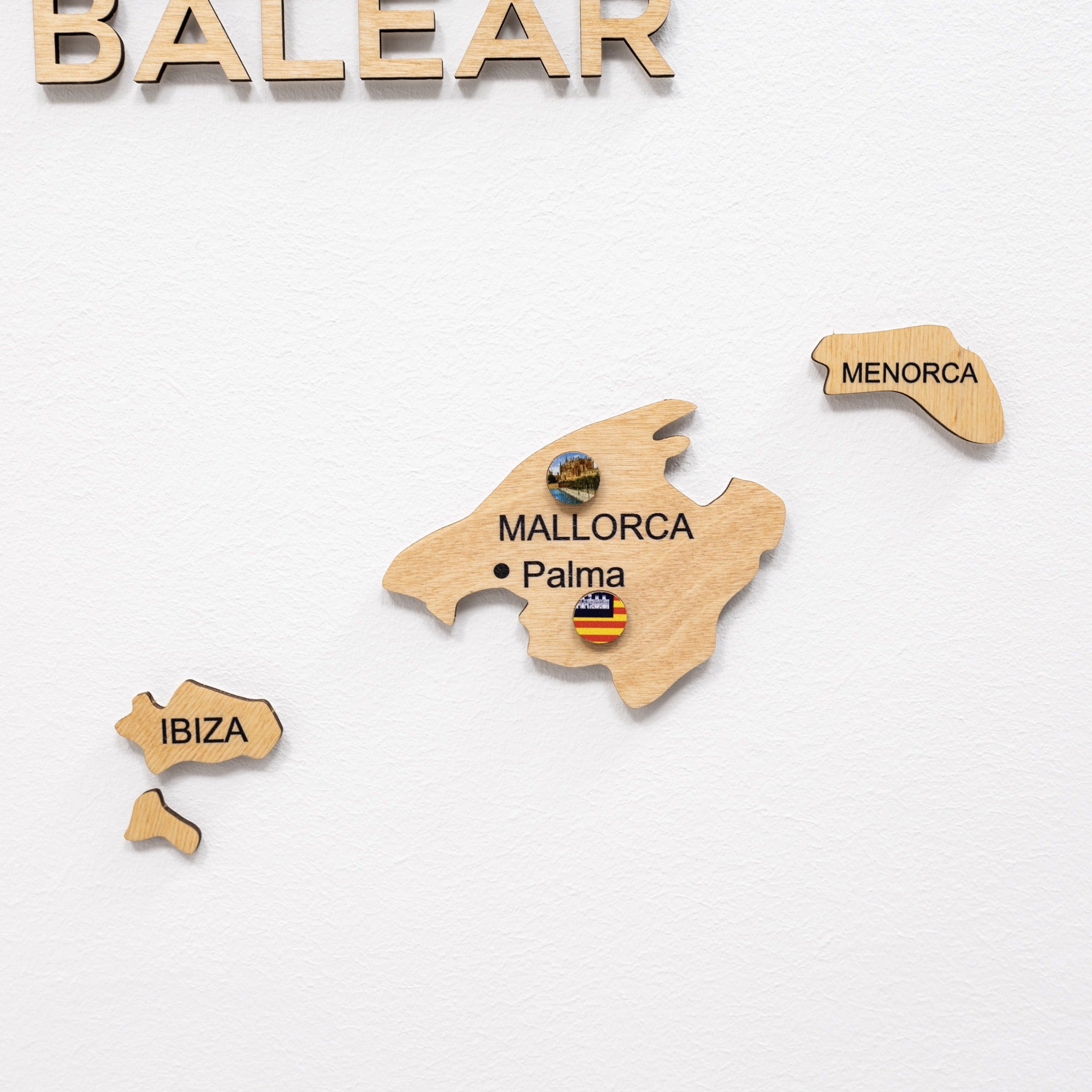 Wooden map of the Balearic Islands with labeled islands on a white background