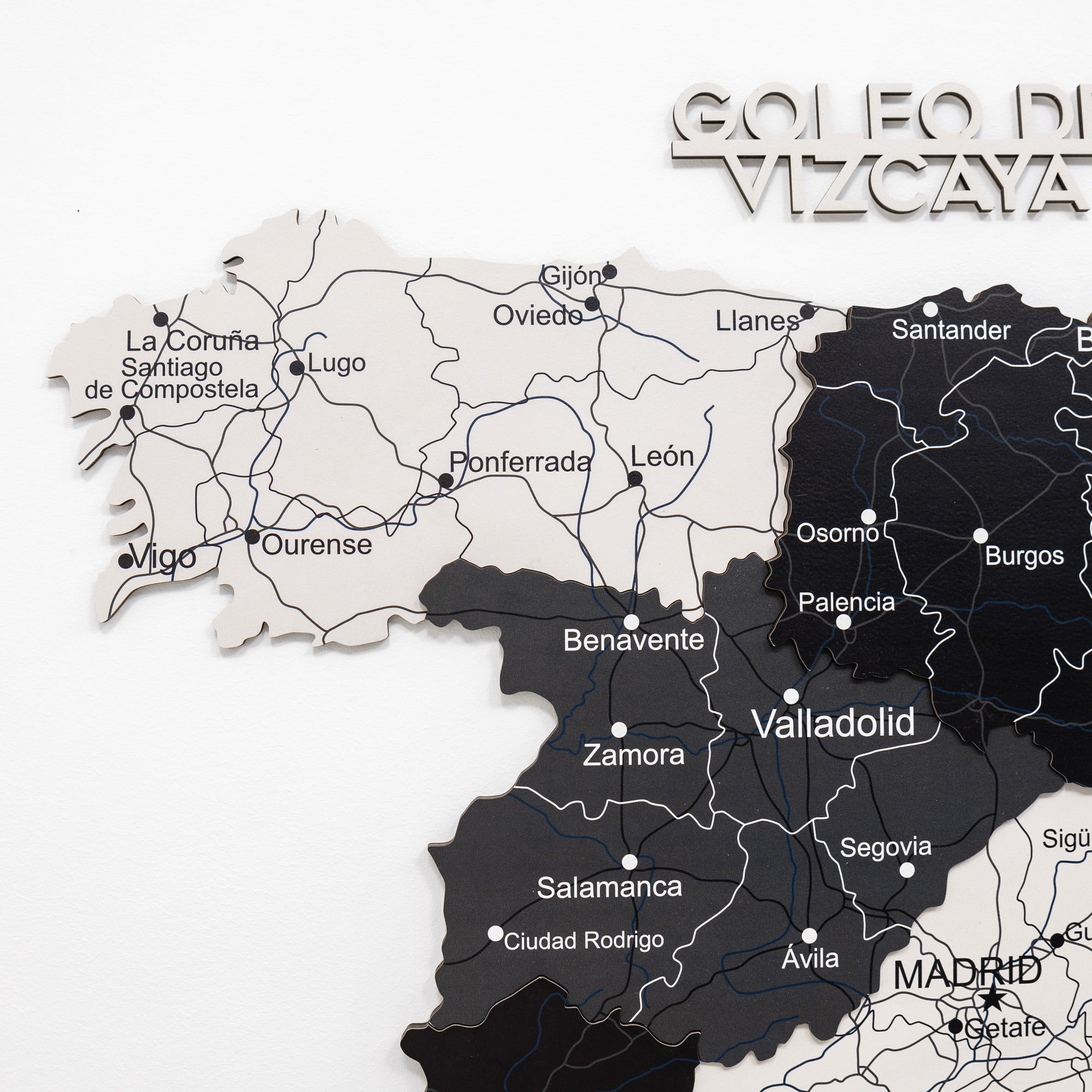 Map of Spain with regions colored black and white, featuring cities like Madrid and Valladolid.