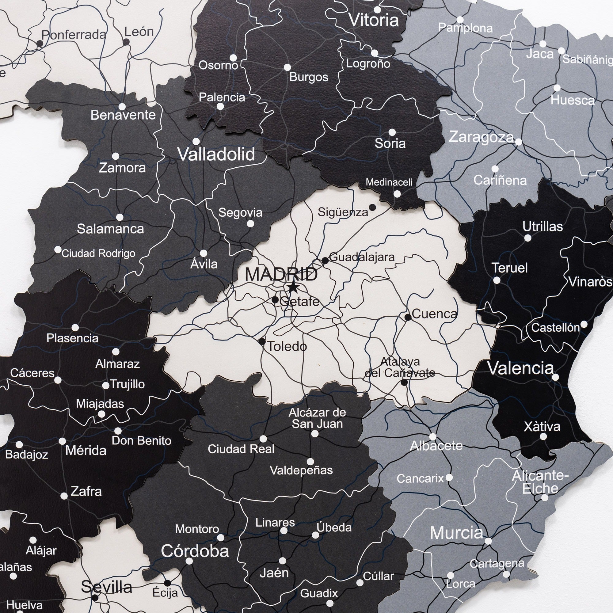 Map of Spain with regions colored in black and gray