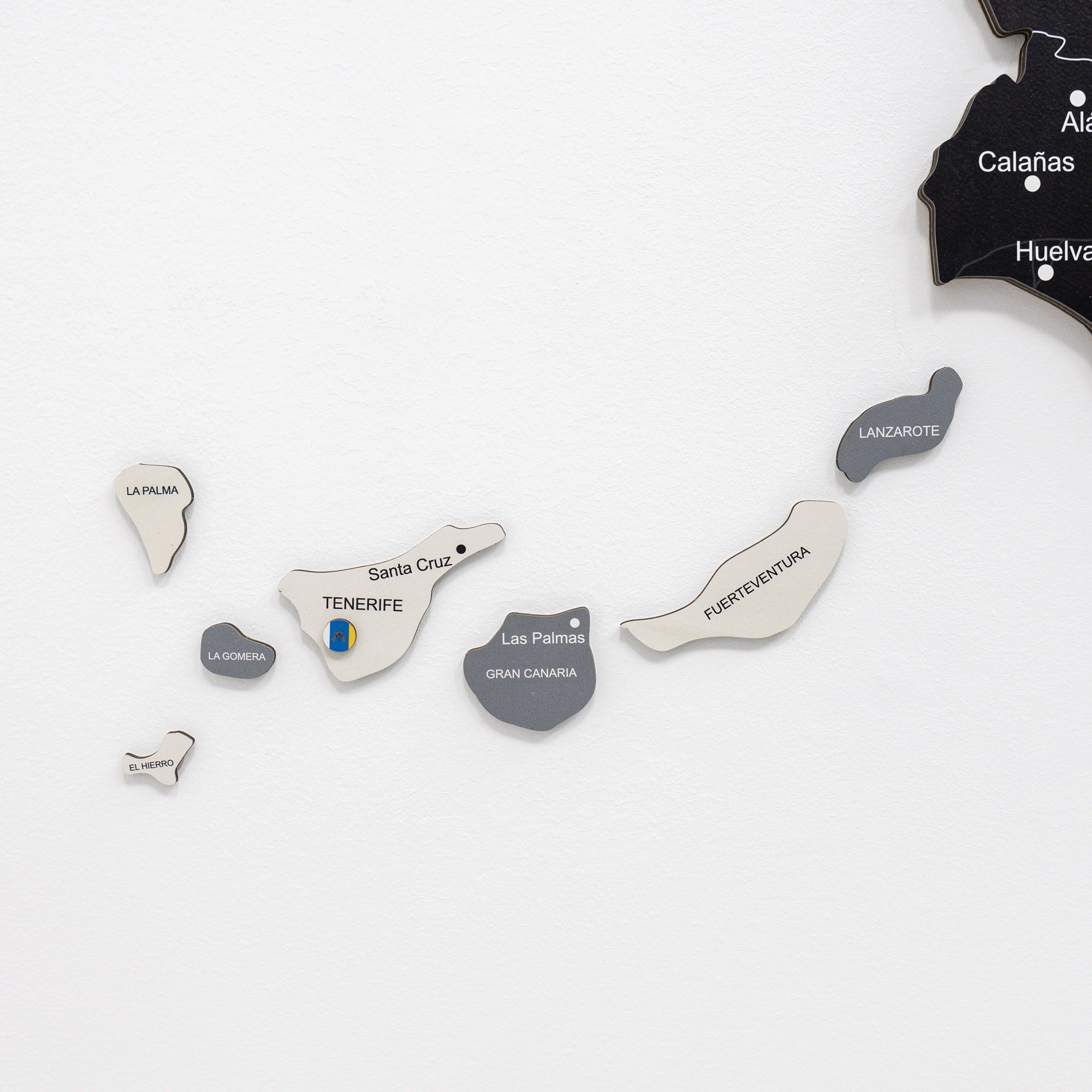 Set of metallic island-shaped objects with text on a white background