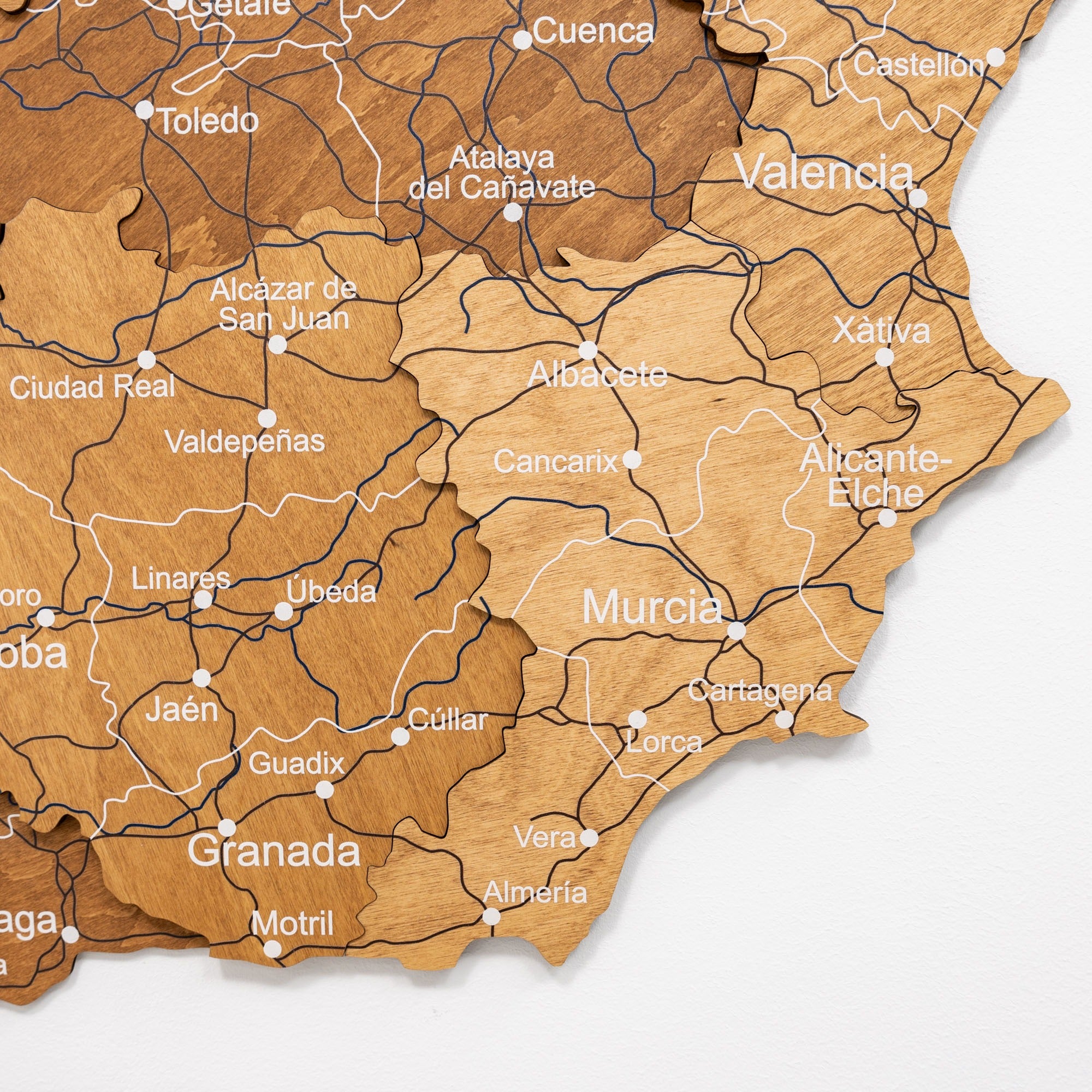 Wooden map of Spain with cities labeled