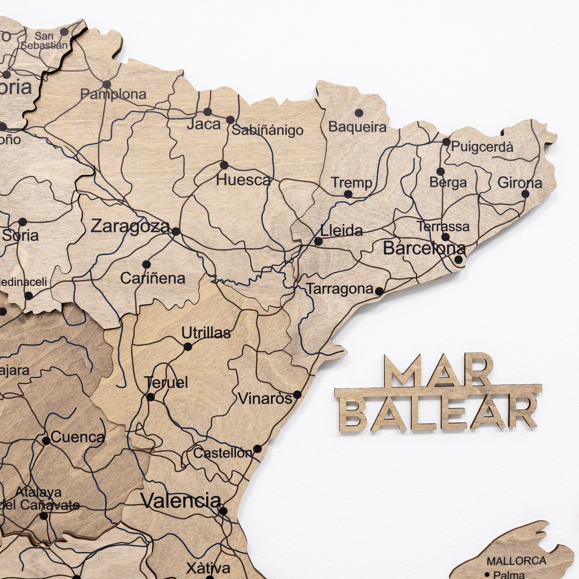 Wooden map of Catalonia with 'Mar Balear' sign on a white background