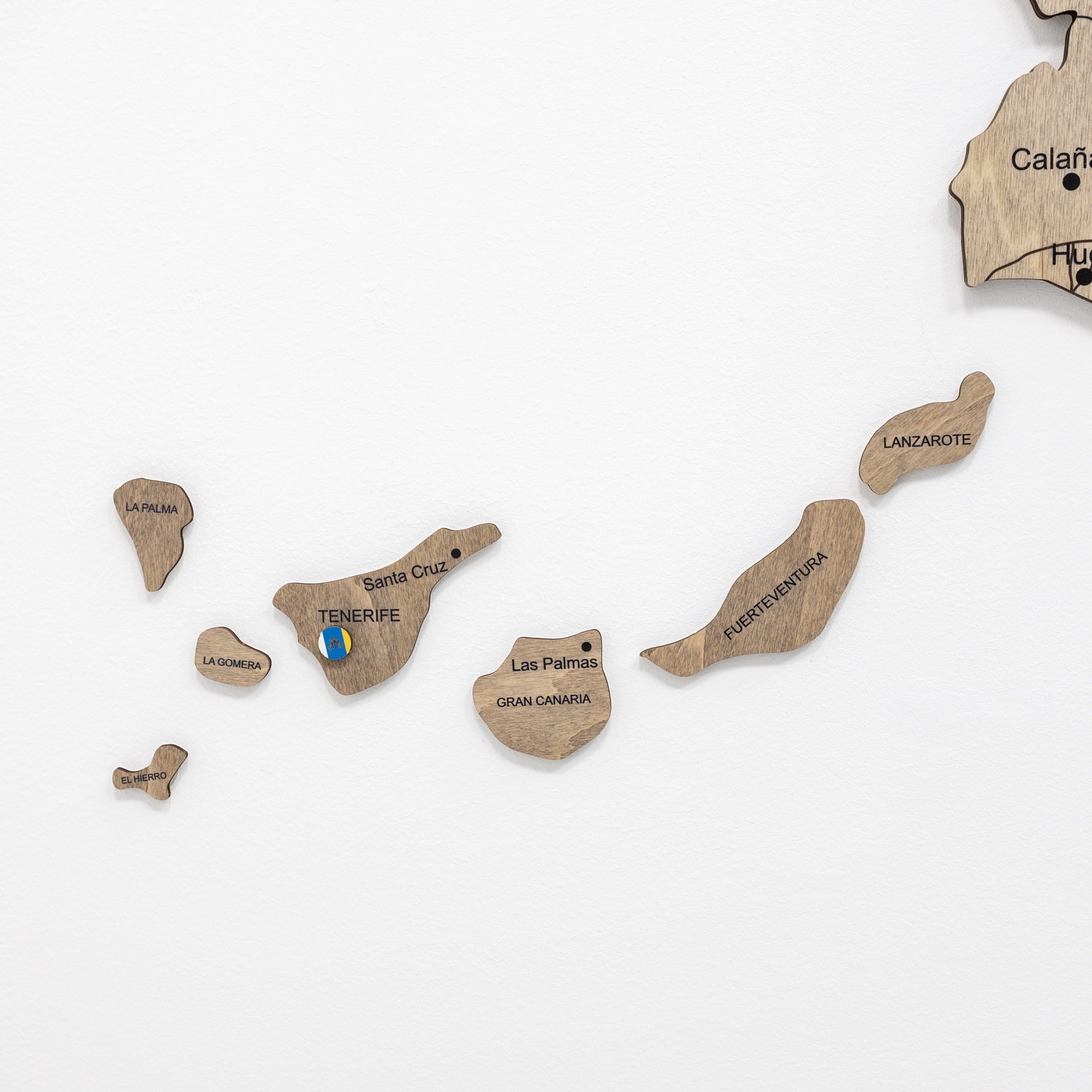 Wooden map of Canary Islands with individual islands labeled on a white background