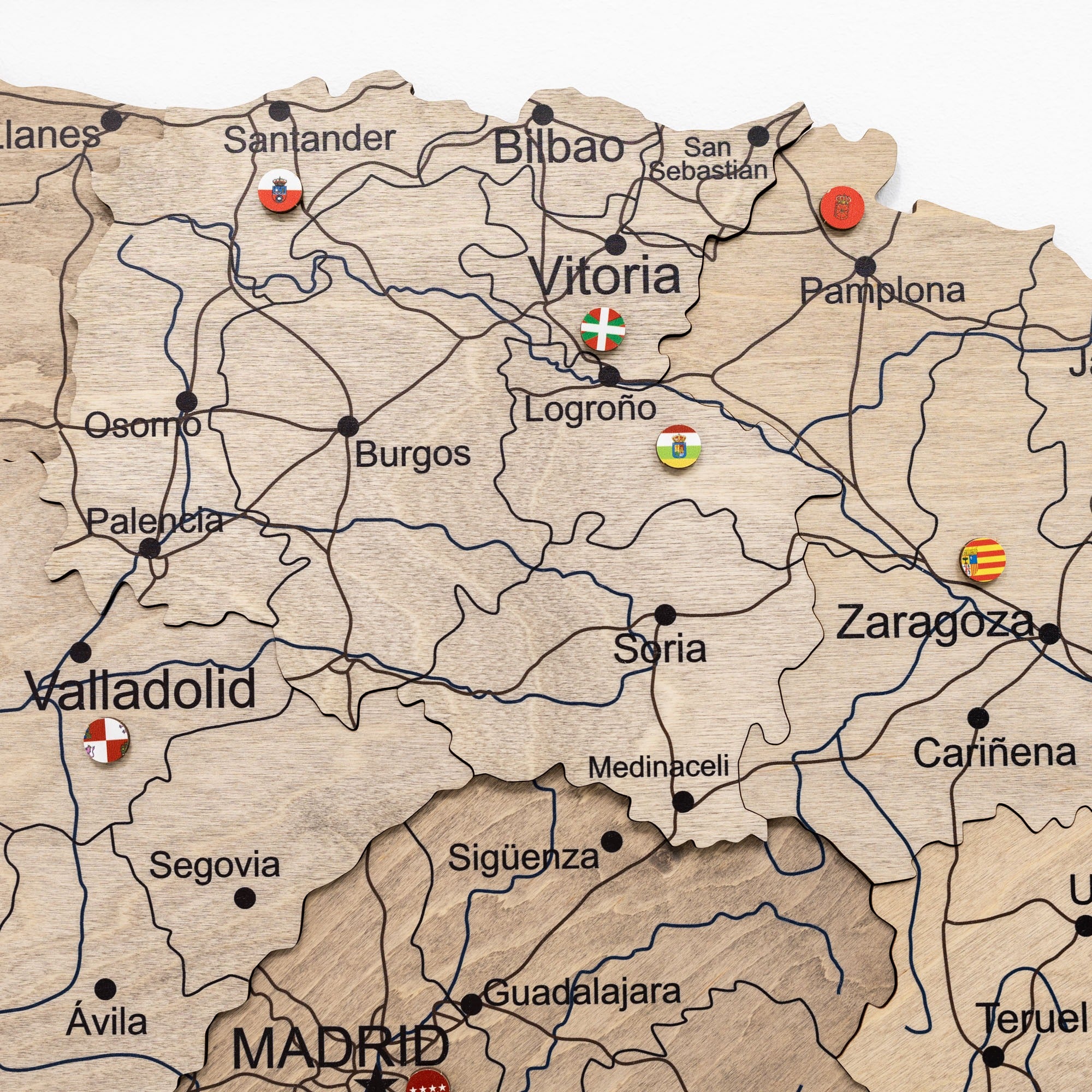 Map of Spain with various cities marked and small flags indicating different regions.