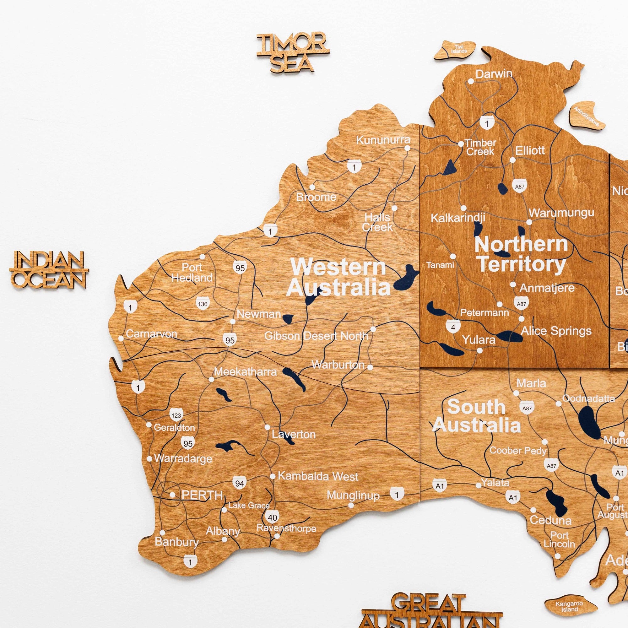 Map of Australia with wooden texture and labeled regions.