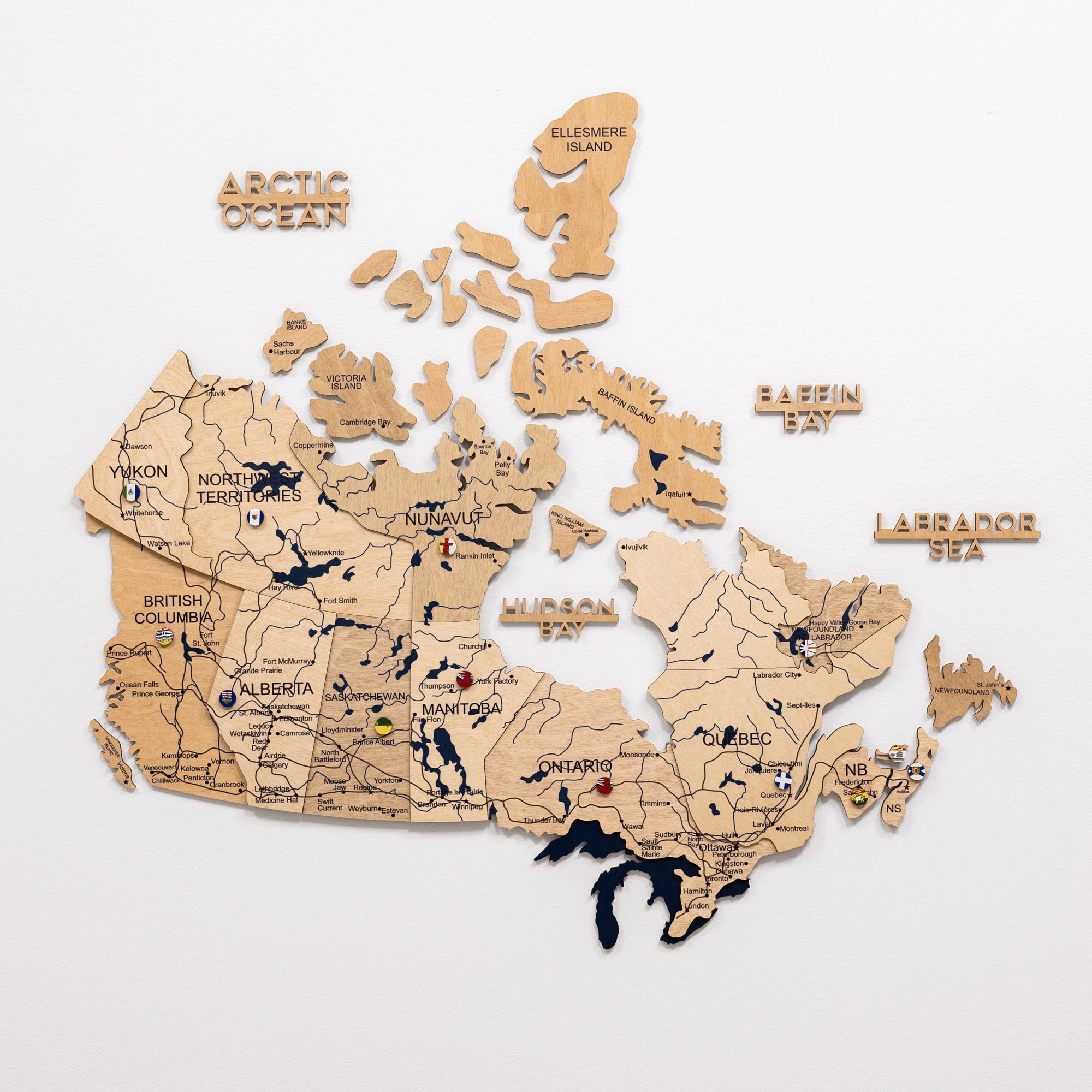 Wooden puzzle map of Canada on a white background