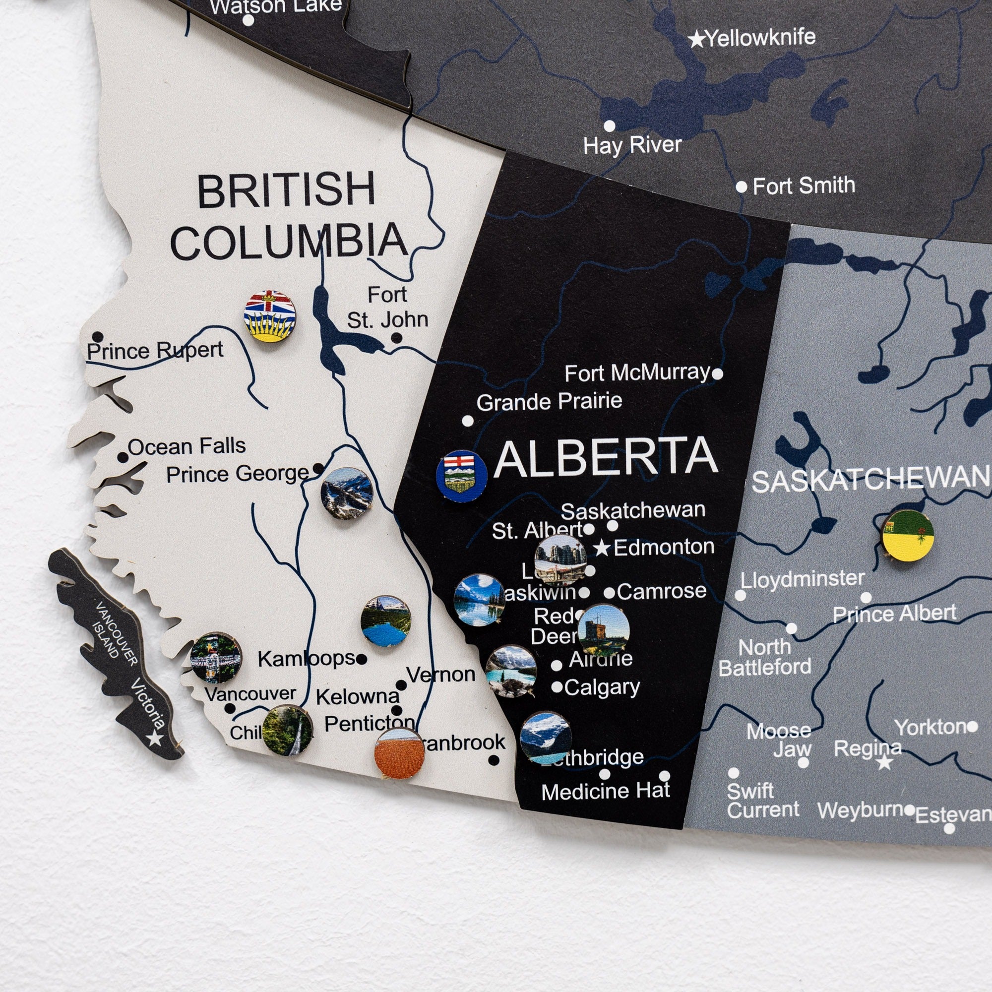 Map of British Columbia, Alberta, and Saskatchewan with city names and flags.